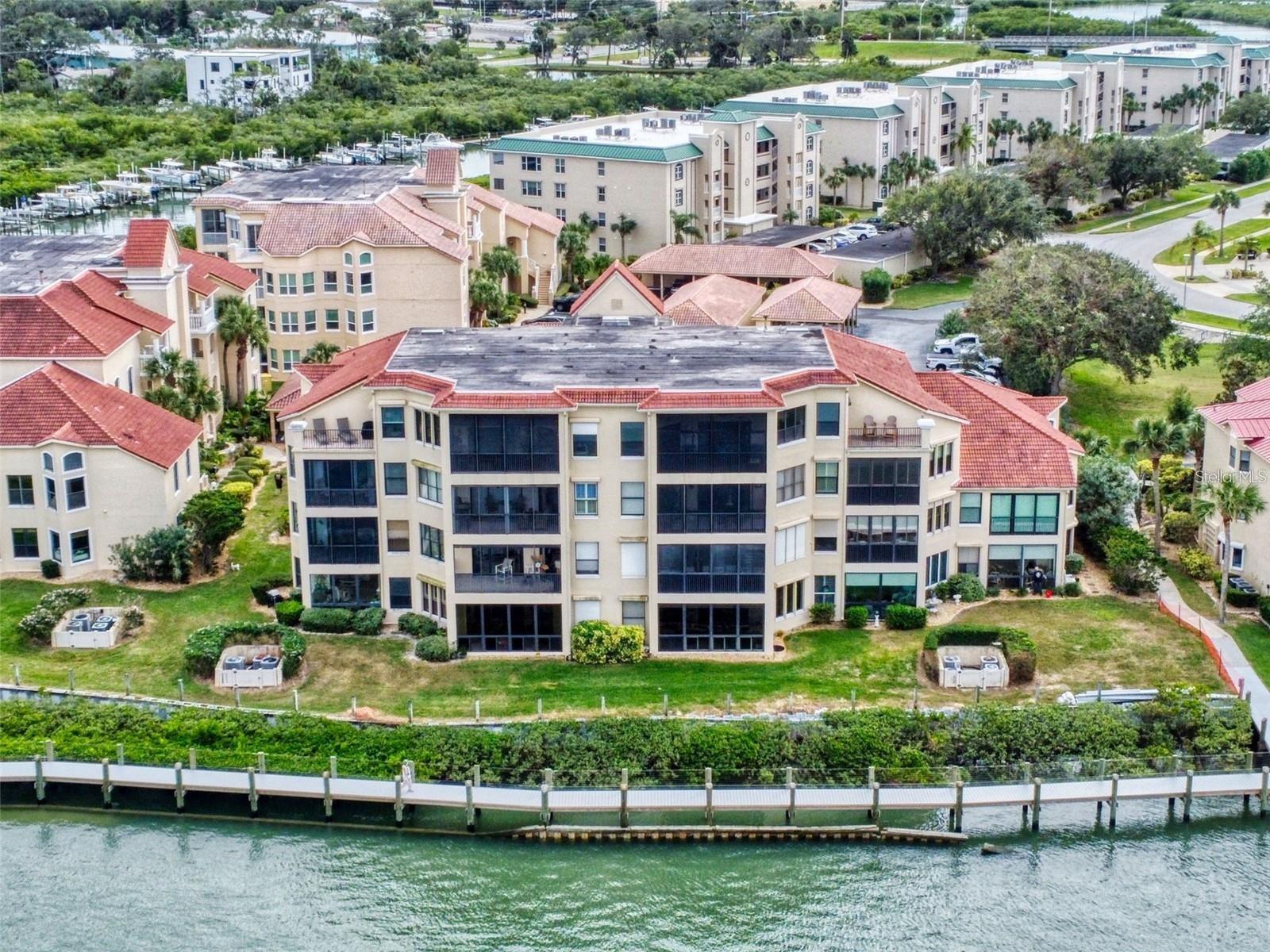 Experience refined waterfront living in this stunning 3-bedroom, 2-bath condominium located in one of the most sought-after buildings in Bouchelle! This exceptional home offers breathtaking, unobstructed views of the river from the living room and primary suite, perfect for relaxing evenings or entertaining guests. This unit comes TURNKEY and ready to move in. The open-concept layout features a spacious living and dining area with lots of windows that flood the space with natural light. With direct water frontage, its perfect for watching the dolphins feed and play all day, you can also enjoy waterfront activities right from your doorstep. Additional amenities include 2 pools, tennis/racquetball courts, tiki huts, private boat ramp and possible boat storage. Located in a desirable waterfront community, this condo is just minutes from local dining, shopping, and recreational activities.