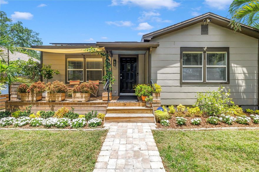 Experience the ultimate Sunshine City lifestyle in this charming bungalow, where local breweries, coffee shops, boutiques and restaurants are practically your backyard neighbors. The curb appeal is a literal showstopper. Beyond the fenced front yard, you’ll find vibrant landscaping so lush it looks like it stepped right off the pages of Home and Garden magazine. After pausing on the adorable front porch, enter the light filled living room where the timeless original hardwood flooring carries you throughout the home. Off the living space, you’ll find two guest bedrooms and a beautiful   updated bathroom. This dedicated wing of the home provides exceptional privacy for family or guests.

The heart of the home is the trendy kitchen, anchored by stunning wood grain cabinetry, granite countertops, and a gas range. The island features bar stool seating, perfect for a quick bite, while overlooking a large dining area that doubles as a flex living space. Beyond the dining room, step into the spacious ADU, perfect as a lucrative rental, guest suite, or a secluded primary retreat. You’ll fall in love with the second renovated bathroom, boasting high ceilings and moody floor to ceiling tile. Complete with a brand new mini split AC system and its own independent entrance and backyard, this space is a rare St. Pete find. Modern efficiency meets historic charm here, as the home features solar panels that will be fully paid off at closing, providing the incredible benefit of a monthly electric bill averaging only $35.

The magic continues outdoors where manicured greenery surrounds a tranquil shaded porch. This deep lot offers ample space for a future pool addition and features a climate controlled art studio for year round creativity, a separate storage shed, and a greenhouse. Enjoy the ease of alley access parking with a dedicated 2+ car parking pad situated behind the rear fence line. It’s the perfect spot to keep your vehicles off the street while maintaining the home's pristine exterior.

Just four blocks from Central Avenue and a a few blocks from the Warehouse Arts District, you are steps from St Pete’s iconic hot spots like Wild Child, Oyster Bar, Urban Stillhouse, and 3 Daughters Brewery, as well as coffee favorites like Bandit, Blk Crow and Concrete Coffee. Fitness lovers are only two blocks from St. Pete Athletic, Beachtown Yoga and CrossFit9, with immediate access to the Pinellas Trail for a quick bike trip to Downtown.

Don't just visit the Burg, live in the heart of it. Grab your bike, bring your dreams, and get ready to enjoy the best of St. Pete right from your own front porch.
