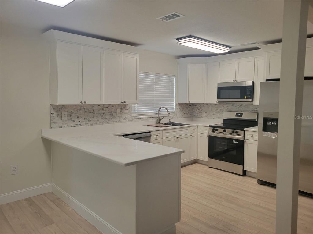 Photo of 6412 Wingfoot Circle, Tampa, FL 33634 (MLS # TB8468742)