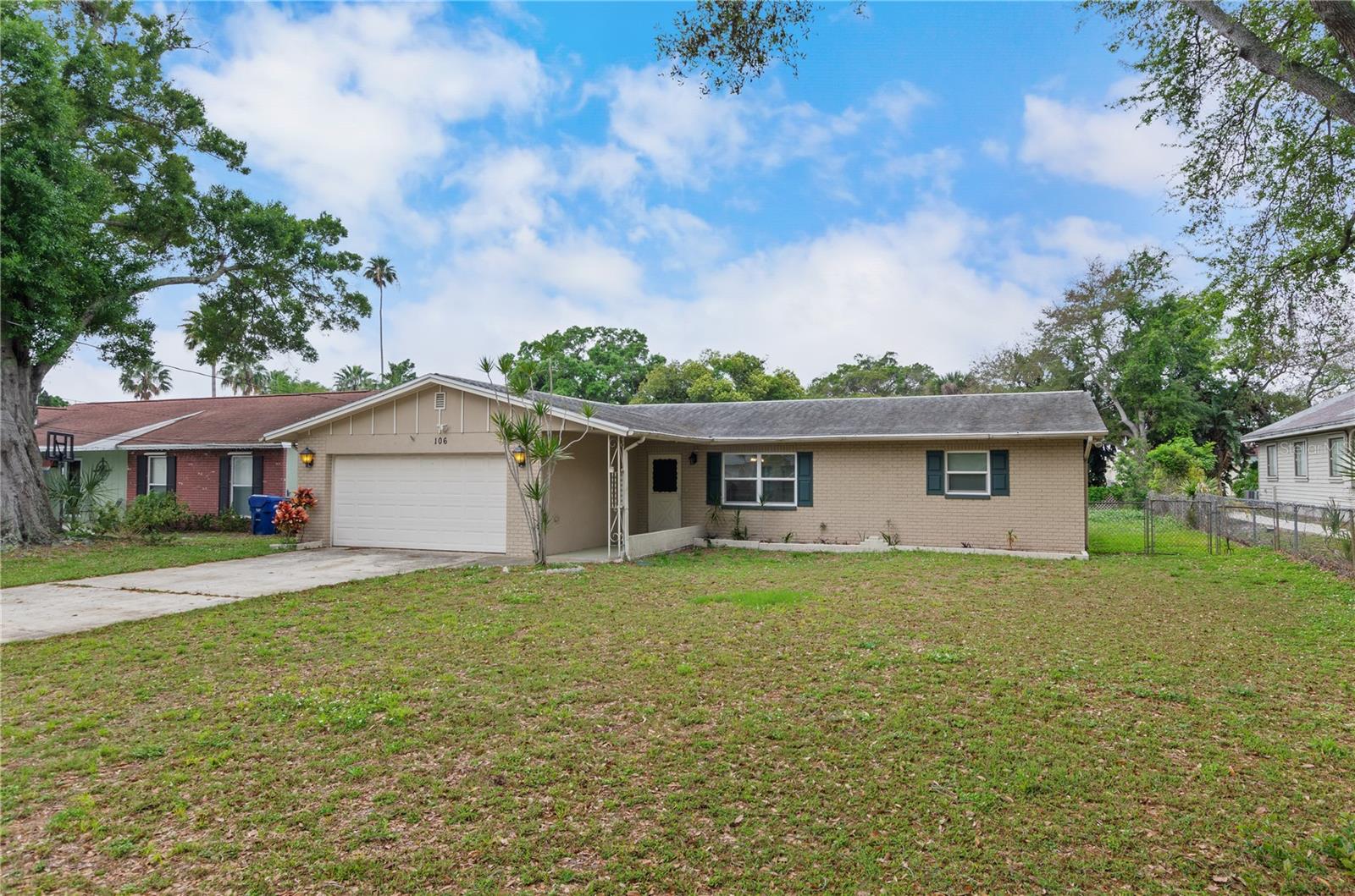 This spacious 3 bed 2 bath 2 car garage home is centrally located and comes furnished! Spacious open floor plan with updated kitchen and baths and tiled throughout. Large screened lanai and the large 1/4 acre fenced yard offers great outdoor space for kids play or entertaining. Close to public golf course, parks, shopping, restaurants, schools and library. Just a short ride to the beach and airports!
