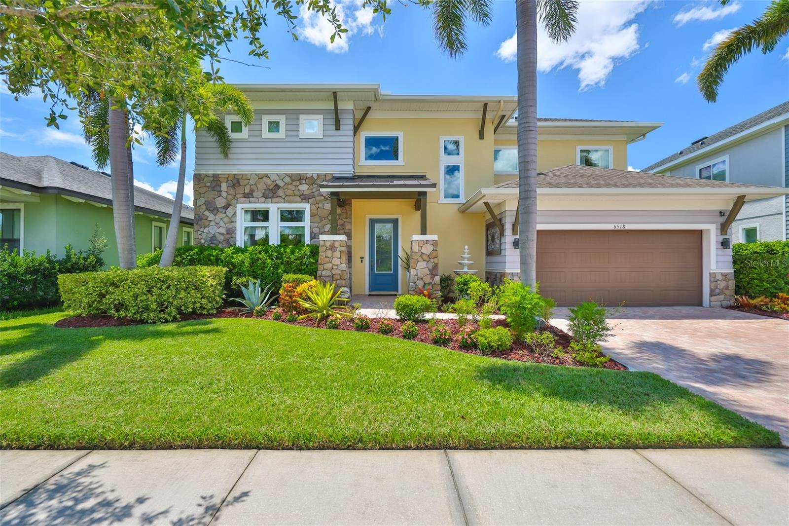 Stunning David Weekley Home in the Highly Desired Waterset Community! Meticulously maintained by its original owner, this beautifully designed home combines timeless architectural style with modern luxury. From the moment you arrive, you'll be impressed by the curb appeal, mature landscaping, a paver driveway, and elegant details set the tone for what's inside. Step through the front door into a space filled with natural light and gorgeous upgrades. The gourmet kitchen boasts an oversized island, premium appliances, and an expansive walk-through pantry that wraps behind the kitchen for added storage and convenience. The dining area, framed by oversized windows, offers a gorgeous view of the pool and backyard, while the open family room features a striking stone accent wall. The office/den with upgraded hardwood floors is perfect for working from home or using as a music room, reading room or study. Guests will appreciate the first-floor bedroom with an upgraded full bath. An additional half bath is located on the first floor for added convenience. The staircase has been beautifully refinished with hardwood steps and decorative iron spindles, leading to a versatile loft space upstairs, ideal as a media room, playroom, or quiet retreat. The primary suite is thoughtfully separated from the other bedrooms for privacy and features an impressive luxurious ensuite bath with a soaking tub, walk-in shower, dual vanities, walk-in shower and a custom walk-in closet. Two additional bedrooms, a full bath and laundry room complete the upper level. Outdoor living is truly exceptional here. Step outside to your own resort. Enjoy a sparkling heated saltwater pool, a spacious covered lounging area, an extended screened paver lanai, and a paver patio with walkways wrapping around the home, all surrounded by lush, private landscaping. Evening gatherings are enhanced by elegant accent lighting and inviting pool illumination. No flood zone and the seller is leaving a pull out generator that will run the whole home. Located in award-winning Waterset, residents enjoy resort-style amenities including multiple pools, fitness centers, clubhouses, pickleball and basketball courts, playgrounds, and miles of scenic walking trails. With easy access to I-75, shopping, and dining, this home offers both convenience and a vibrant community lifestyle. Don't miss the chance to make this spectacular home your own!