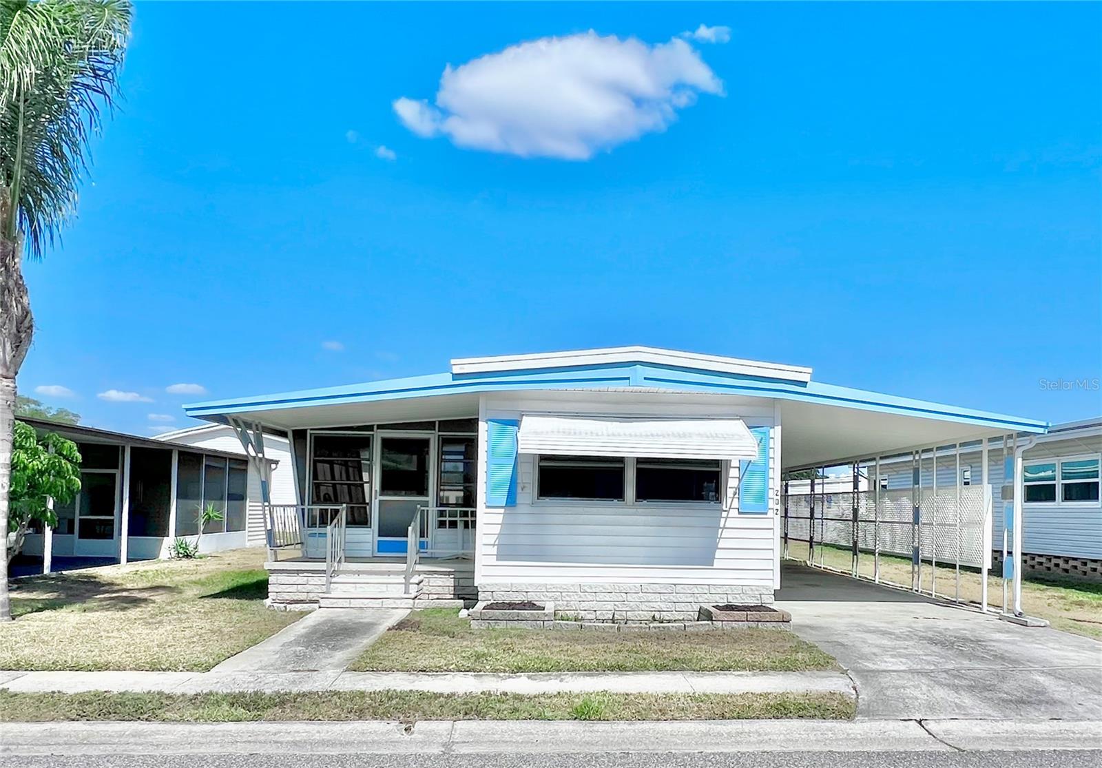 MAKE YOUR APPOINTMENT TODAY AND HAVE A NEW 2026 HOME PUT HERE!!!! Seller may help with the removal of this home with a price reduction or credit to buyer at closing. SELLING "AS IS" LARGE LOT with enough room for a double wide home! Welcome to Fairway Village – Unit 202 | Incredible Value in a Premier 55+ Community. Don’t miss this rare opportunity to own the lowest priced home currently available in the highly desirable Fairway Village, a 100% resident-owned manufactured home community located in sunny Largo, Florida. This 2-bedroom, 1.5-bathroom residence offers a chance to bring your vision to life, whether you're looking to update and refresh the existing interior or replace it entirely and build a brand-new home on this prime lot. The home is vacant and ready for immediate occupancy. Please note that the interior has not been professionally cleaned, as the seller left in a hurry and is no longer living in the home. That said, it’s a blank canvas for the right buyer with an eye for potential. Features include a metal roof-over, vinyl siding, a long driveway with room for two or more vehicles, as well as a newer water heater and air conditioning unit. Included in the sale is the valuable Co-Op Land Share, which is essential for every Fairway Village transaction. Fairway Village is home to 751 properties and caters to residents aged 55 and older. The community is known for its spacious layout, friendly atmosphere, and active lifestyle offerings. Residents enjoy access to a newly built 19,000-square-foot clubhouse that opened in January 2022, offering countless activities and social opportunities. Additional amenities include two swimming pools, Jacuzzis, covered shuffleboard courts, and a nine-hole par-three golf course, all within a secure gated community. Monthly maintenance fees are kept low at just $401 and cover water, sewer, garbage collection, lawn care, basic cable, and fiber optic internet for every home. For anyone planning to reside in the home, a background check is required for each person aged 55 and over. The fee is $100 per person and must be completed before scheduling an orientation and interview with the Fairway Village Residents Association Board of Directors. This is a unique opportunity to purchase a home in one of Largo’s most well-established and welcoming communities. Whether you choose to renovate or rebuild, this property offers incredible potential and a wonderful lifestyle. All measurements are approximate, and buyers are encouraged to independently verify all details. Contact us today to schedule a private showing and take the first step toward making Unit 202 in Fairway Village your next home.