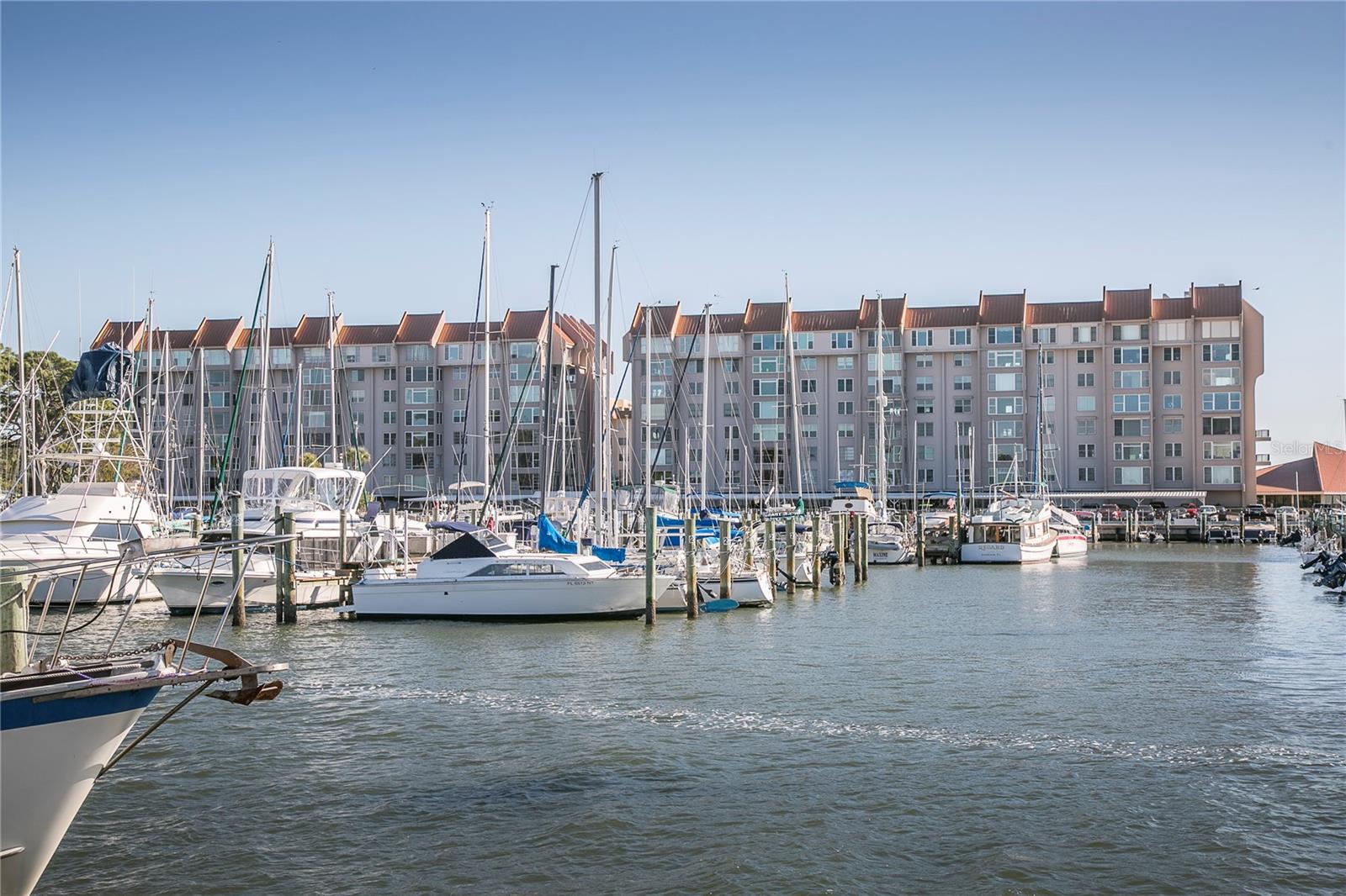 In the heart of Dunedin! Beautiful views of Dunedin Marina and Intercoastal. Spacious end unit , 2 bedroom, 2 bath, luxury vinyl flooring thru-out in this open and airy condo. Fully furnished, located on second floor, a rare outdoor side large balcony, newer hurricane windows, freshly painted, and the building has elevators. Resort living at its Best. Walk to Marina, Downtown, Restaurants, parks, and festivals, close to beaches, shopping, and airports. This community is a 55 + community, No Pets / No Smoking. Annual rate $ 2650, if seasonal, rates will apply plus tax, six month minimum association.