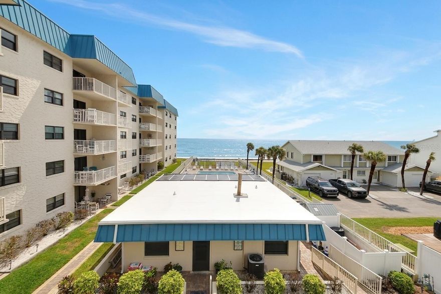 One or more photo(s) has been virtually staged. Whether you're a beach lover or someone searching for a low-maintenance coastal escape, this opportunity captures the essence of oceanfront living with the added benefit of income potential. 

Welcome to your private coastal retreat in New Smyrna Beach where laid-back beach living meets strong income potential. Ideally located along South Atlantic Avenue on the No Drive beach, this direct oceanfront 1-bedroom, 1-bath condo offers access to the sand just steps from your door. The bonus room offers a great opportunity for extra guests or office space.

On the third floor, this residence provides the perfect balance of elevation and accessibility, allowing you to enjoy sunrises, refreshing sea breezes, and the soothing sound of waves from your own private escape. Thoughtfully maintained and offered fully furnished, this unit is completely turnkey, ready for personal enjoyment or continued use as a high-performing rental.

Short-term rentals are allowed, and the property comes with an established rental history, making it an excellent opportunity for investors seeking reliable, income-producing coastal real estate. Rental income available upon request. Whether you're looking to generate revenue, enjoy a vacation getaway, or both, this condo offers flexibility to suit your lifestyle. 

Inside, the space is designed for comfort and functionality, with a light and airy coastal feel that complements the oceanfront setting. The open living area flows seamlessly to maximize natural light and showcase the stunning views, while the bedroom provides a relaxing retreat after a day spent on the beach.

Spend your mornings watching the sunrise over the Atlantic, your afternoons with your toes in the sand, and your evenings unwinding to the rhythm of the ocean, all from one of Florida’s most beloved beach communities.

Local dining and shopping available across the street or just up the road. Drop a line in the water in the ICW or drive a few minutes South to enjoy the incredible Canaveral National Seashore.

Notice: Clubhouse photos are virtually staged.