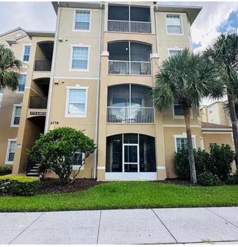 Photo of 2778 Almaton Loop #303, Kissimmee, FL 34747 (MLS # O6413616)