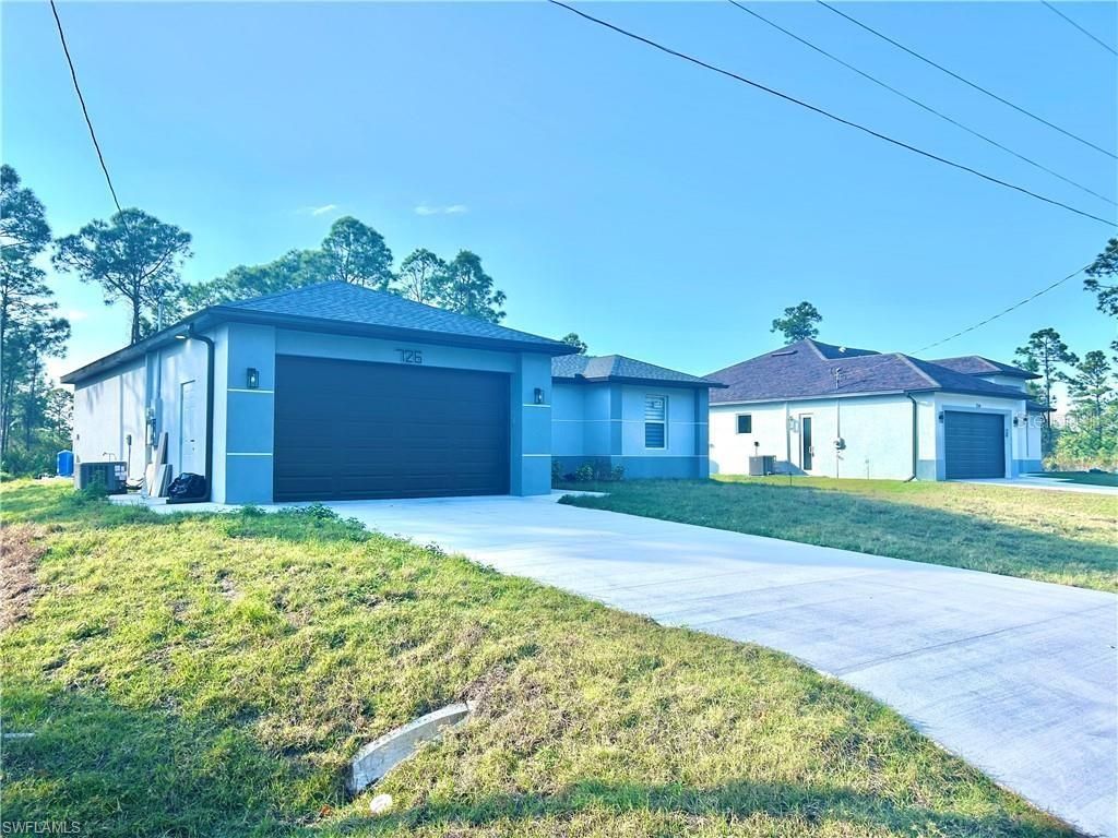 Photo of 726 Giorgio Avenue S, Lehigh Acres, FL 33974 (MLS # A4686311)