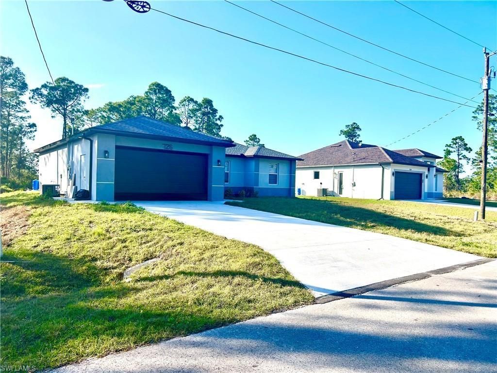 Photo of 726 Giorgio Avenue S, Lehigh Acres, FL 33974 (MLS # A4686311)