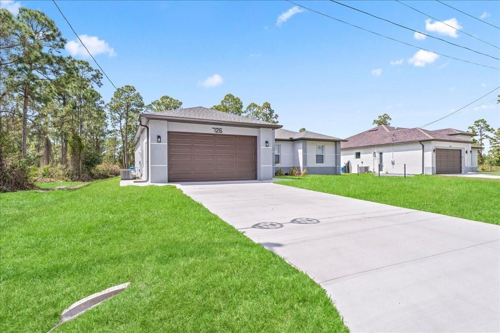 Photo of 726 Giorgio Avenue S, Lehigh Acres, FL 33974 (MLS # A4686311)