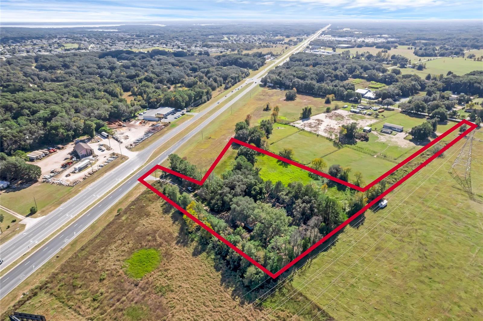Investor Opportunity: Prime Land for Self-Storage Development Near The Villages and Ocala. The property's proximity to both Ocala and The Villages positions it in the path of rapid residential and commercial growth. Demand for storage continues to rise due to housing development, downsizing trends, and population increases throughout the region. Nearby parcels do not currently have the same utility access, giving this site a development-ready advantage. This 3.82-acre parcel presents a rare opportunity for investors or operators in the self-storage industry. Ideally situated just off the Belleview Bypass (SE 92nd Loop), this site offers excellent access, high visibility, and zoning flexibility in a high-growth corridor. The property is zoned B-4 (Heavy Business), allowing for a wide range of commercial development, including self-storage, RV and boat storage, contractor units, or mixed-use service facilities.
Strategically located with access from both S US Hwy 441 and SE 135th Street, the site benefits from its direct connection to major transportation routes including I-75, US 301, US 27, Hwy 441, and SR 40. The Belleview Beltway project is expected to significantly increase traffic flow in the area, further enhancing visibility and long-term value.