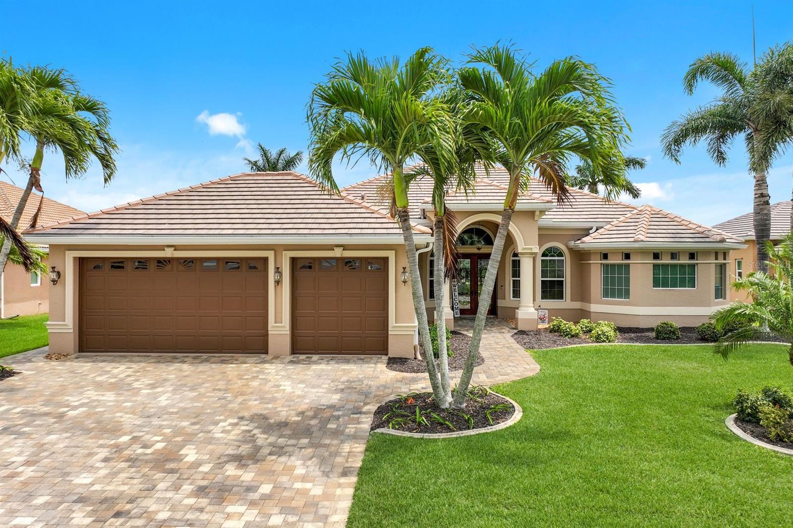 Welcome to your tastefully remodeled Gulf Access estate home located in Gate 4 of the coveted boating community of Cape Harbour! This luxurious home embodies waterfront living at its finest with new 10’ sliders along the back of the home allowing for plenty of light and expansive waterviews from the kitchen, living and dining. Entertaining is easy in your gourmet kitchen with wall oven and microwave, solid wood cabinetry, toe kick lighting, granite counters, pot filler, and dining nook overlooking the pool. The split bedroom floorplan provides privacy for owners and guests, with the owner’s suite featuring a tray ceiling with recessed lighting and a cozy sitting area with french doors leading to the lanai. Newly remodeled owner’s bath showcases a large soaking tub with walk-through shower, dual vanities, linen closet, and private water closet. Swim year-round in your electric heated pool and spa with outdoor kitchen & bar, and ample room under truss for outdoor living and dining. Other updates include A/C (2022), roof (2022), pool heater (2021), bathroom remodel (2020), electric panels (2018), and hurricane impact sliders/windows/doors (2018). This is your opportunity to live the Florida life--schedule your private tour today!