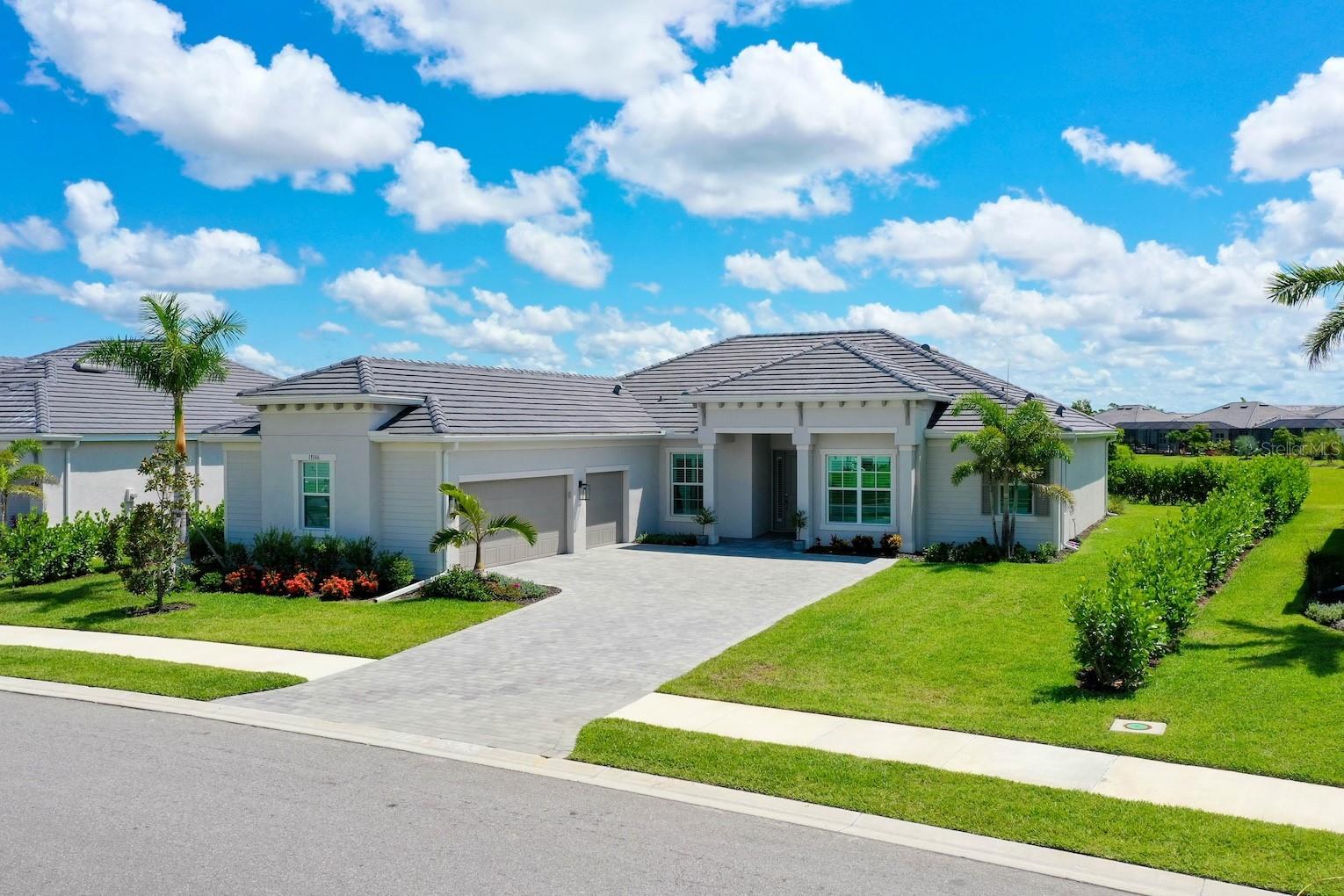 Welcome to your dream, GOLF DEEDED (no initiation fee) home in the heart of Wellen Park Golf & Country Club! This is one of the last remaining GOLF DEEDED, ESTATE HOME LOTS AVAILABLE & is FILLED w/ UPGRADES. This stunning 2024 built Napoli II floor plan features 4 bedrooms, 2.5 bathrooms, and is the ONLY SIDELOAD 3 CAR GARAGE floor plan! Situated on one of the LARGEST LOTS in the community, this property provides extra space and privacy while overlooking a serene, protected preserve. Enjoy the ultimate Florida lifestyle with a DEEDED GOLF MEMBERSHIP, granting you access to the community’s 18-HOLE GOLF COURSE.
Over $50K in UPGRADES done by the sellers, which include: fully ACd garage w/ fully insulated attic and insulated garage doors, garage storage racks, upgraded PLANTATION SHUTTERS throughout the home, FULL HOUSE GENERATOR, all interior CUSTOM PAINTED, kITCHEN BACKSPLASH, custom glass shower door in guest bathroom, fans in every bedroom, custom light fixtures installed, TV brackets with outlets added, extensive landscaping of over 100 Clusia hedges on property line to promote privacy / tranquility, and seamless gutters added to the whole perimeter of home for storm protection.The chef’s kitchen, designed for entertaining and functionality, features an OVERSIZED ISLAND, STAINLESS STEEL APPLIANCES, an abundance of cabinet space, and promotes an OPEN CONCEPT to the home. Built to top hurricane codes, the home includes IMPACT WINDOWS AND SLIDING DOORS for superior storm protection.
Beyond the home, Wellen Park Golf & Country Club offers an exceptional resort-style experience with a 18-HOLE GOLF COURSE (just pay a cart fee to play), TIKI BAR/RESTAURANT, TENNIS and PICKLEBALL COURTS, and the main community, RESORT STYLE POOL and GYM/DAY SPA opening early 2025. The low HOA dues include your GOLF MEMBERSHIP, all AMENITIES, GATED ENTRANCES, basic cable and internet, and FULL LAWN MAINTENANCE with irrigation water. With plenty of room to add your dream POOL, this home is truly an entertainer’s paradise. Located just minutes from the vibrant hub of WELLEN PARK, you’ll enjoy convenient access to DOWNTOWN WELLEN PARK’S shopping, dining, entertainment, and healthcare nearby, while savoring the tranquility of your private oasis. Plus, NUMEROUS BEACHES are a short drive away. Don’t wait—schedule your showing today and start living your Florida dream!