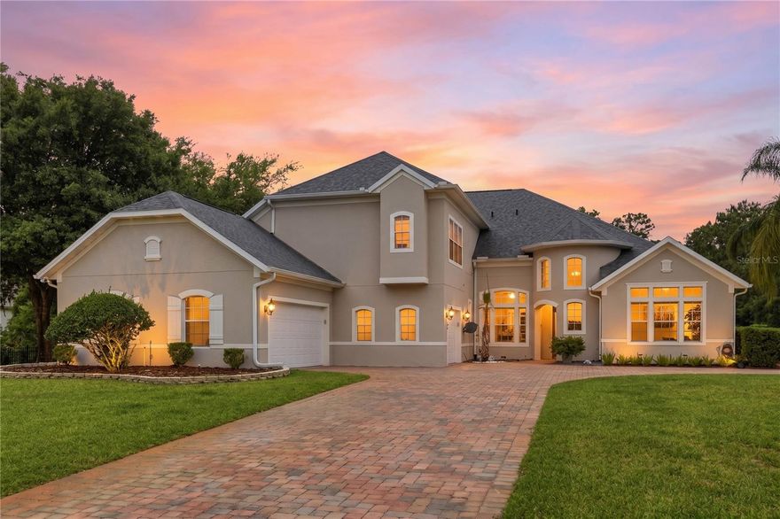 Tucked away in the gated enclave of Live Oak Estates in the heart of Lake Nona, this stunning estate offers the perfect blend of luxury, privacy, and space. Situated on over an acre, 14106 Oakwood Cove Lane features 5 bedrooms, 5.5 bathrooms PLUS a bonus room, and over 4,300 square feet of beautifully designed living space. From the moment you arrive, the circular driveway, mature landscaping, and grand courtyard-style entry create an unforgettable first impression.

Inside, soaring ceilings, crown molding, and expansive living areas provide an elegant yet comfortable atmosphere. The updated chef’s kitchen is equipped with granite countertops, stainless steel appliances including a gas range, and opens seamlessly to the spacious family room with a cozy gas fireplace overlooking the amazing outdoor kitchen & resort-style pool and spa. The thoughtfully designed floor plan offers generously sized bedrooms, multiple entertaining spaces, and a luxurious primary suite on the main floor.

Step outside to your private backyard retreat where the sparkling pool, spa, and oversized lot create the ultimate Florida lifestyle experience with plenty of room to entertain, relax, or even expand. Located just minutes from Medical City, top rated schools, Orlando International Airport, major highways, dining, and shopping, this exceptional Lake Nona property offers both tranquility and convenience in one of Orlando’s most sought-after areas.