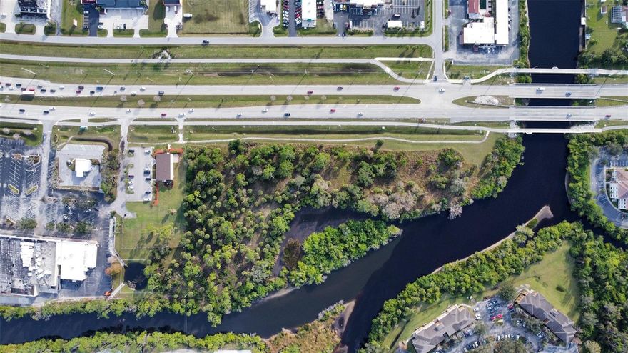 Prime Commercial Waterfront Opportunity!
Located in ACTIVITY CENTER 1, this property offers unmatched potential with its desirable WATER FRONT SETTING and high-visibility TAMIAMI TRAIL FRONTAGE. The location and zoning allow for a variety of permitted uses, making it a versatile investment opportunity.

Imagine the possibilities:

A restaurant with waterfront views, creating a true destination spot for dining.

Professional offices, retail, or service-based businesses.

Other commercial opportunities permitted under the Activity Center 1 zoning designation.

With its unique combination of waterfront appeal and commercial flexibility, this property is perfectly positioned for a visionary developer or business owner looking to capitalize on North Port’s growth.
Approx 5 miles to Wellen Park and less than 5 miles to the Coco Plum shopping area.