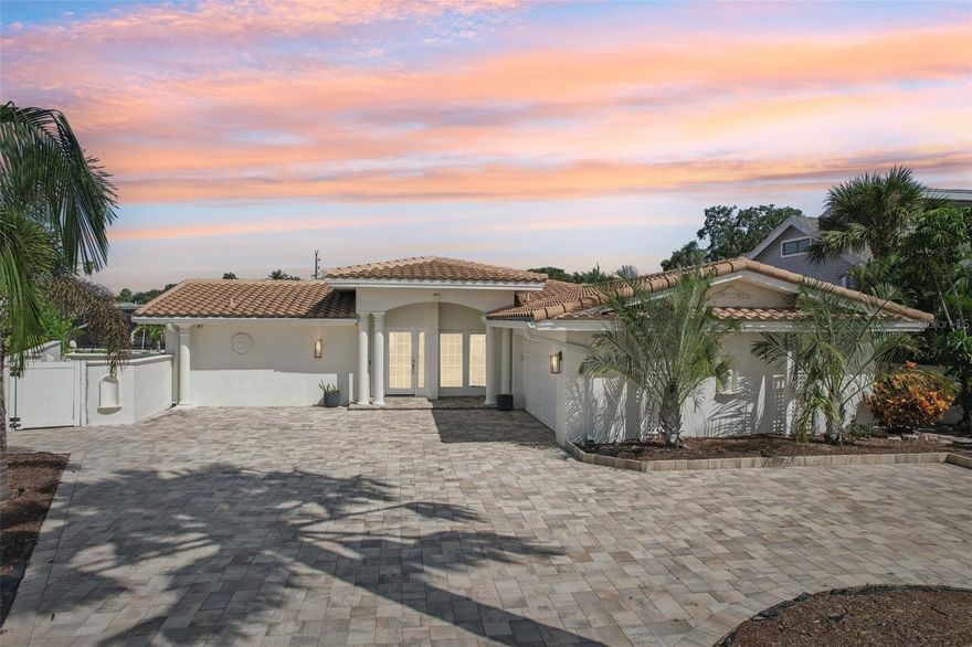 A Rare Waterfront Gem with Massive Income Potential in Largo’s Harbor Hills! This isn’t just a home—it’s a powerhouse investment opportunity wrapped in the beauty of Florida coastal living. Nestled at the end of a quiet cul-de-sac in the coveted Harbor Hills neighborhood, this spectacular 4-bedroom, 3-bath waterfront residence spans 2,378 square feet and offers jaw-dropping open water views, direct Gulf access, and an enviable 102 feet of water frontage. Currently operating as a high-performing, fully booked Airbnb, this property is already city-approved and inspected for short-term rental use by the City of Largo. With multiple six-figure gross income potential, this is a rare opportunity to own a turnkey income-generating machine, vacation retreat, or dreamy full-time residence—all in one and a business that works while you sleep. Inside, you'll find soaring elegance with luxurious travertine flooring, granite countertops, and spa-style ensuite bathrooms. The open-concept kitchen features a wide expanse of counters, solid wood cabinetry, sleek appliances, and abundant storage—perfect for entertaining or hosting guests. The dining area’s electric fireplace adds a cozy, refined touch to evening meals and gatherings. The primary suite offers a true retreat with glass sliders opening to the pool deck, a generous walk-in closet, and a private ensuite bath. Guests will enjoy their own beautifully appointed bedrooms and bathrooms, each offering privacy and comfort ideal for vacation rentals or extended stays. Step outside; whether you're soaking in the sun or entertaining guests, the private heated pool and expansive patio deliver a resort-style experience. Enjoy serene water views, multiple seating areas, and the perfect backdrop for unforgettable Florida sunsets. Boaters will love the 10,000 lb boat lift and direct Gulf access, putting adventure right at your back door. This home blends luxury and durability with a 50-year barrel tile roof, hurricane-rated windows, dual-zone HVAC, a tankless water heater, and a new paver circular driveway added in 2023. Everything has been thoughtfully maintained and updated to ensure ease of ownership and peace of mind for years to come. With no HOA and no CDD, this home gives you total freedom to enjoy, rent, or live on your terms. Minutes from world-class beaches, fine dining, and shopping, this Harbor Hills stunner combines luxury, location, and limitless potential. Whether you’re looking to build a portfolio, enjoy seasonal escapes, or settle in paradise full-time—this property delivers on every front. Call now and schedule your viewing today!