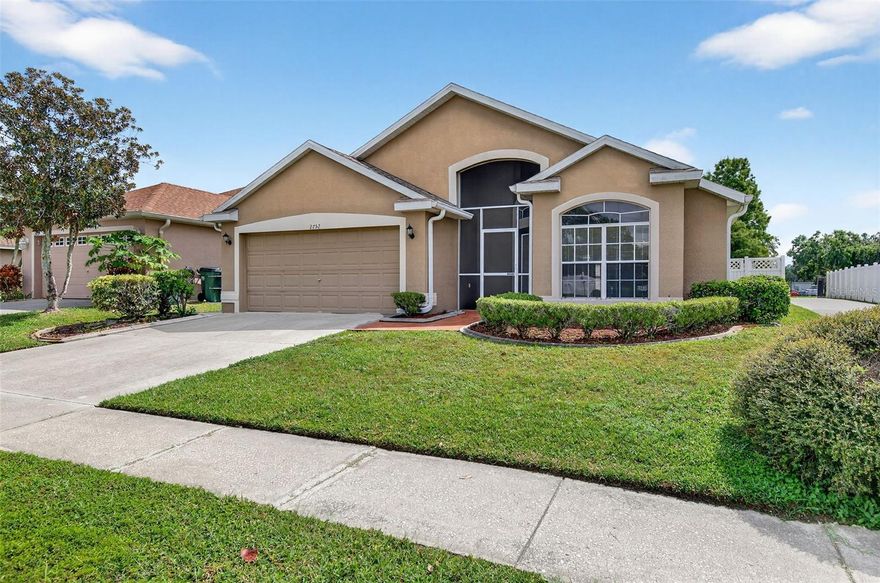 Great value in Valencia Gardens, a gated community along the popular Collier Parkway corridor.  Priced well below recent formal appraised value. This 3 bedroom home has soothing fresh paint inside and awaits your finishing touch. No homeowners insurance woes, as the home was RE-ROOFED in October 2020 and lies outside of flood zone. Low cost of living with NO CDD tax and a low $741 per year HOA fee. The split bedroom floor plan offers private retreats as well as flexible gathering spaces for both formal and informal activity.  Step out the sliding door and relax on your covered & screened lanai that looks out over a fully fenced back yard. No rear neighbors and full southern exposure. A perfect environment for your plants and garden. Valencia Gardens is a desireable gated community within an extremely popular geographic area. Super convenient access to activities for all ages. Walk directly from this property to the elementary school, day care or pre school via safe off-street direct paved access.  Valencia Gardens is also directly across Collier Parkway from the expansive Pasco county recreation center that offers not only soccer and baseball but also Olympic swimming pool, indoor basketball gym, tennis courts, and even a skate board rink. Less than a mile from the supermarket and shopping that can be accessed from wide golf cart friendly sidewalks.  Very  centric location for the commute as well with easy access to the major  arteries such as SR54, I75/275, The Veteran’s Expressway/Suncoast Parkway. Short drive to urban Tampa. Tampa International Airport and The Gulf.