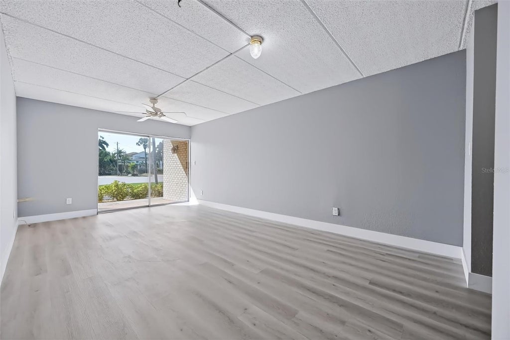 Photo of 10365 Paradise Boulevard #5, Treasure Island, FL 33706 (MLS # TB8560487)