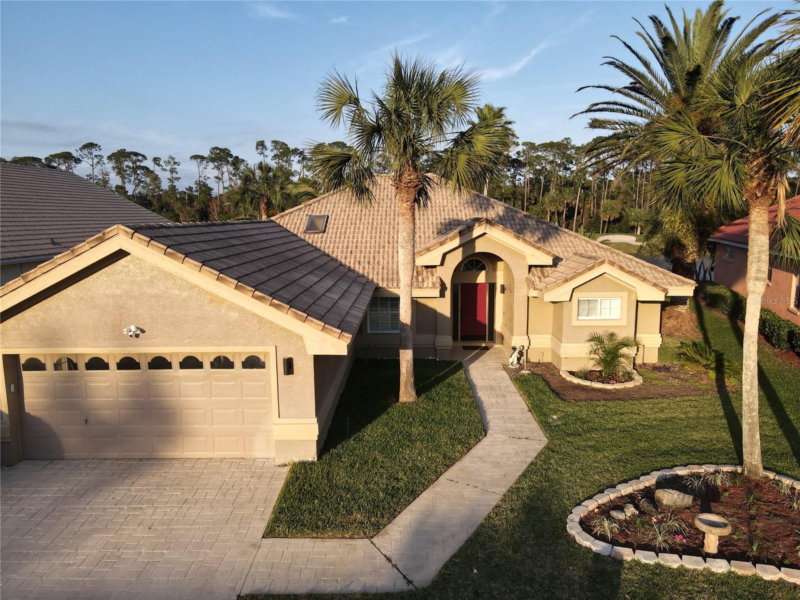Welcome to 417 Long Cove Road, a beautiful 3-bedroom, 2-bathroom home located in Plantation Bay community of Ormond Beach, Florida. This spacious residence offers 2,175 square feet of living space, providing ample room for comfortable living. Upon entering, you'll be greeted by an open floor plan featuring high ceilings and abundant natural light. The formal living room boasts tile floors and large windows, creating a bright and inviting atmosphere. Adjacent to the living room is a formal dining area, perfect for hosting gatherings. The kitchen is equipped with stainless steel appliances, granite countertops, and a breakfast bar, making it ideal for both cooking and entertaining. A cozy breakfast nook offers serene views of the pool area. The family room features wood plank tile floors, a gorgeous Lake view and built-in shelving, providing a warm and welcoming space to relax. Continued
The master suite is a private retreat, complete with wood plank tile flooring, sliding doors leading to the lanai, a tray ceiling, and a walk-in closet. The en-suite bathroom has been remodeled to include granite countertops, new soft-close cabinets, a walk-in tile shower, and a soaking tub. Additional bedrooms are spacious and well-appointed, offering comfort and flexibility.
Step outside to discover a renovated pool area with a pavered lanai, and pebble tech finish, all overlooking a large, private yard. Located on a cul-de-sac, this home offers both privacy and tranquility. As a resident of Plantation Bay, you'll have optional access to amenities such as golf courses, tennis courts, and clubhouses, enhancing your living experience.
Available to rent NOW