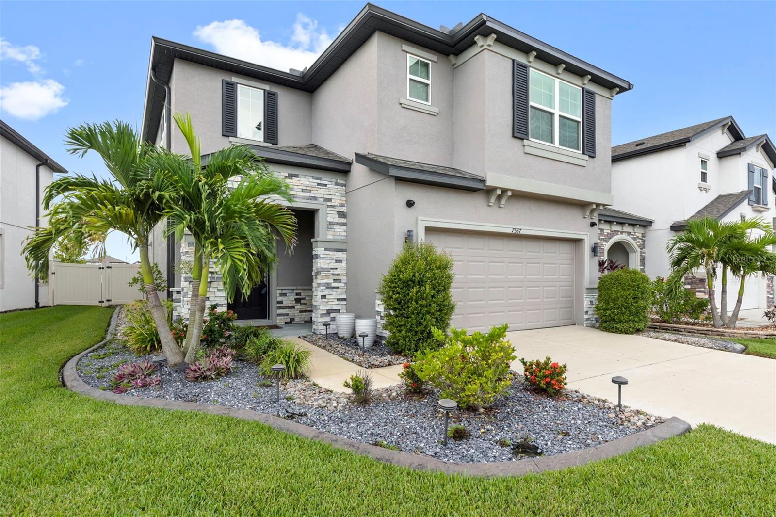 Step inside this meticulously maintained home and discover over $60,000 in premium upgrades. From the stately iron staircase to the new chandeliers, every detail has been thoughtfully chosen. The open-concept floor plan is perfect for both daily life and grand entertaining. The gourmet kitchen is a chef’s delight, featuring upgraded Samsung appliances, a large walk-in pantry, and a beautiful tile backsplash. You can even enjoy tranquil pond views while you cook. Upstairs, a versatile open loft provides flexible space for a home office, a media room, or a play area. The spacious primary bedroom is a peaceful retreat, and two additional bedrooms offer comfort and privacy for family and guests. The second floor also includes a convenient laundry room and a full guest bathroom. Outside, the living space continues with an expansive paver patio and a covered lanai, ideal for outdoor gatherings. The fully fenced yard and peaceful pond views create a private, serene setting. Added features like remote sunscreens and security cameras provide extra comfort and peace of mind. Epperson Ranch isn't just a place to live; it's a resort-style community with unmatched amenities. The 7.5-acre crystal-clear lagoon is the heart of the neighborhood, offering a sandy beach, a swim-up bar, a thrilling slide, a climbing wall, and a floating obstacle course. Enjoy live music from the covered stage, or take your kayak out from the dock. The community also features a dog park, miles of scenic trails, and golf cart paths. There's a covered playground for the little ones, ensuring fun for all ages. Whether you’re relaxing by the lagoon or exploring the neighborhood trails, Epperson Ranch offers a truly unique and vibrant lifestyle. This move-in-ready home, with its elegant design and functional layout is a rare find. Schedule your private showing today and seize this extraordinary opportunity!