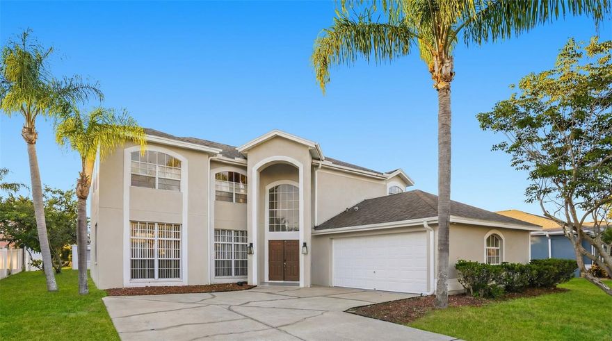 One or more photo(s) has been virtually staged. Welcome to this spacious two-story home featuring 5 bedrooms, 2.5 bathrooms, and a 2-car garage. Inside, you’ll find a formal dining room and versatile living spaces. Outdoors, enjoy a screened-in lanai leading to an inground pool and a covered back porch—perfect for enjoying Florida living year-round.