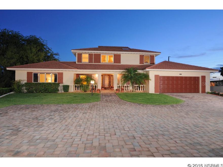 Quality surrounds you in this lovely intra-coastal home located in Port Orange on the beachside just .4 miles North of Dunlawton. A rated schools. This unique home offers amazing river views. A well laid out, bright, open floor plan which has been meticulously cared for inside & out. The living rm w/hardwood flooring has a travertine stone fireplace w/custom shelving. The dining rm is ample in size with glass doors to lanai & is separated from the living rm w/columns. The kitchen has incredible views of the river & boasts loads of counter space, wood cabinetry, pull outs, double ovens, desk, and buffet area, perfect for large gatherings. The enclosed Florida rm has access to both covered lanais. The first covered lanai is open to the backyard and has access to the family rm and Florida room. The 2nd lanai opens up to pool w/pavers and has access to living rm, dining rm, & Florida rm. Each bedroom is oversized for potential sitting areas. The master suite is the ultimate retreat measuring 22x22 with its own private balcony (22x22) for sunbathing. Or walk out to your 12x19 open balcony. Melt away in your 12x13 spa bath w/double vanities, Jacuzzi tub for two & oversized walk-in shower. Walk out to your dock w/deep water, electricity, 4,500 lb. boat lift, & picnic area. Recent improvements include new tile roof on first floor, plantation shutters, $50,000 in hurricane shutters and hurricane impact screens, pool resurfaced and newer spa, newer pool pump, summer kitchen, buried propane tank, tankless hot water system. ;Water: City