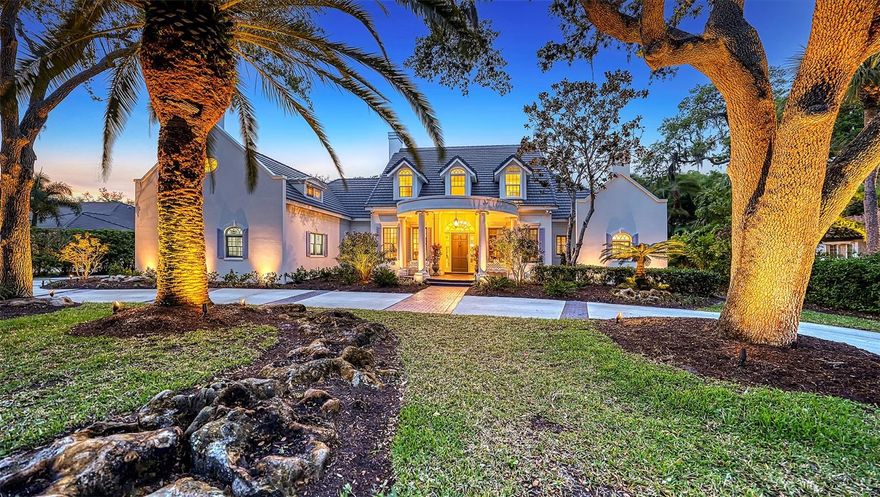 This 5 bedroom, 5.5 bath home, custom built by Baron, offers over 4,700 square feet of the finest living area you’ll find in The Oaks Bayside. Surrounded by mature landscaping, and backing to Historic Spanish Point preserve, this home enjoys a peaceful, tropical setting. Walk down the pavered path and enter through the front door and you will find two stories made for gracious living. This immaculate home offers everything you will need to live a luxurious, yet comfortable, lifestyle. Beautifully updated and meticulously maintained, you will be delighted by all the special touches in this home. From custom designed plaster crown moldings to the light and open kitchen there is so much to love; marble and updated wood floors, a gorgeous wood paneled office/den, updated bathrooms, a large private guest suite, a newer roof, a true lap pool in the screened lanai and a three car garage are some of the many things that you will love! The freshly painted exterior and new outside lighting makes this abode a dream to come home to, day and night. With a warm welcoming glow as the sun sets on another perfect Florida day, you will feel a sense of pride and contentment knowing this is home. You may have heard it before, but when it comes to this house, truer words were never spoken, you absolutely must see it in person to appreciate all it has to offer. The Oaks, Sarasota’s Premier golf and country club, has two championship golf courses, twelve HAR-TRU tennis courts (4 lighted), a junior Olympic community pool, croquet, pickleball, a state-of-the-art fitness center and a wide variety of dining, social and recreational options. Club membership required with homeownership.
