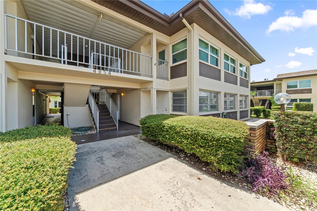 Photo of 4854 Marine Parkway #101, New Port Richey, FL 34652 (MLS # A4704709)