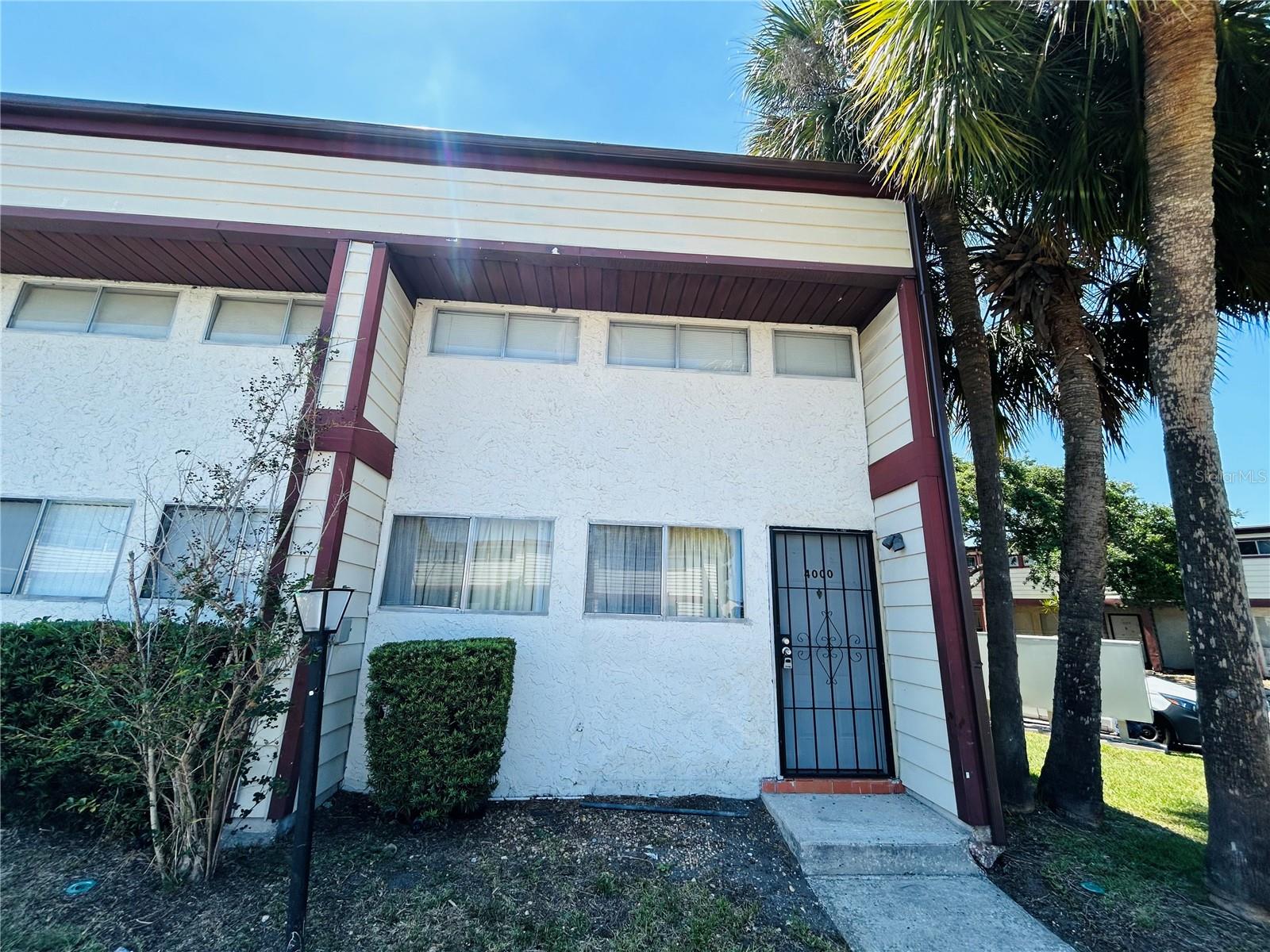 Large and spacious 1/1 townhome in the Village! Unit features custom draperies, tile throughout, updated kitchen and bathrooms, covered balcony upstairs and a covered patio and fenced in backyard. The Village features a boat ramp and swimming pool. Association approval required.