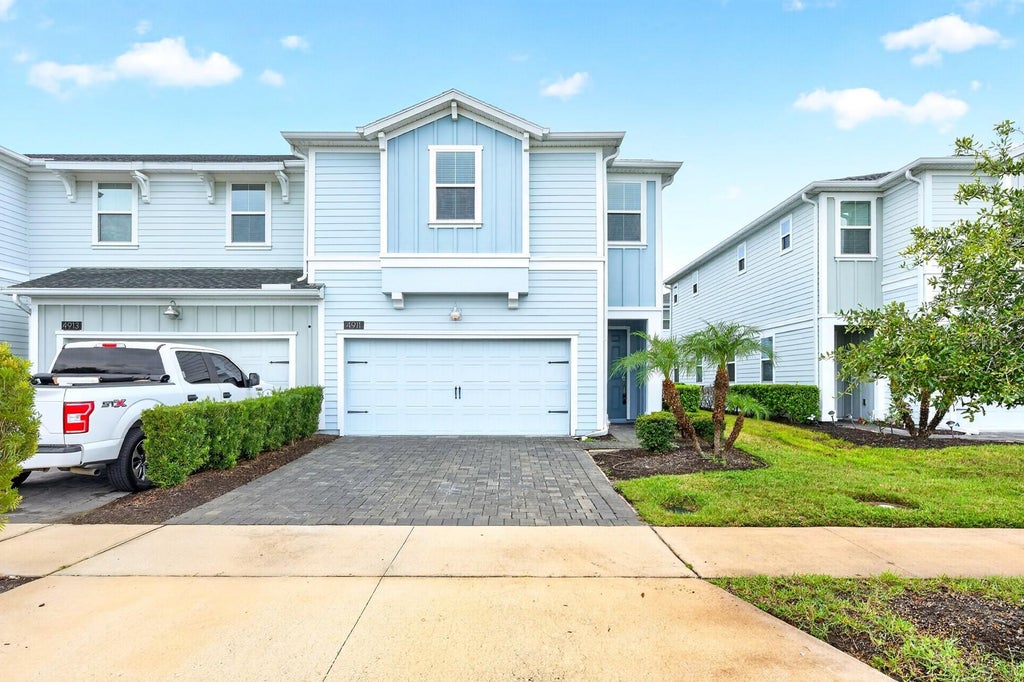 Photo of 4911 Tribute Trail, Kissimmee, FL 34746 (MLS # O6446579)