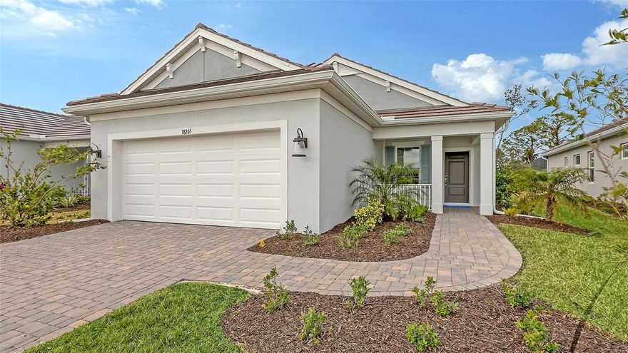 The Patriot, by Neal Communities, is a very popular floor plan now available at Wysteria in Wellen Park.  This particular home design features a welcoming front porch.  Inside, you step into a grand foyer that leads to the open great room along side a large kitchen.  This highly sought after kitchen has a big island, soft close cabinets, pot/pan drawers along with plenty of counter  & cabinet space!  This home has gorgeous Level 5 Wood-look tile floors and 8' interior doors! This new home also has Impact Resistant Glass. This particular home is currently being built with a 2 ft garage extension, utility sink in the garage, as well as on a conservation homesite!