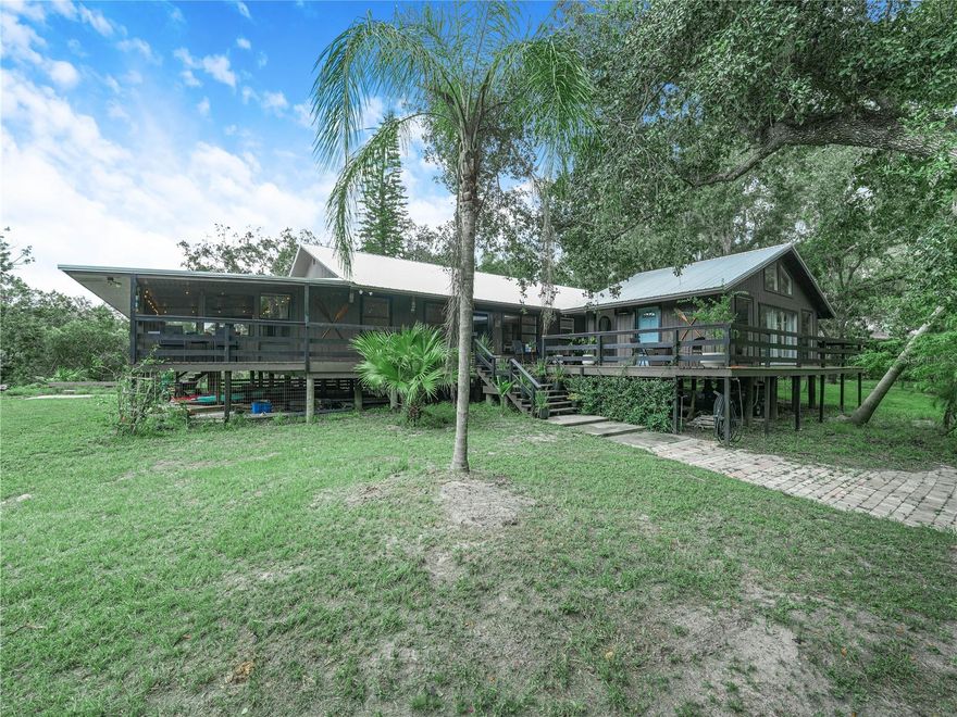 Imagine waking up to the gentle flow of the Peace River right outside your bedroom window.
This stunning 4-bedroom main home sits on 7.33 acres of pure Florida beauty, where deer stroll through the yard and nature surrounds you in every direction. It’s like living in the most luxurious summer camp imaginable—year-round.

Inside, no detail has been overlooked. Every inch is fully upgraded with exquisite finishes, blending rustic charm with modern comfort. When it can’t get any better, you discover the mother-in-law suite/guest house—perfect for visiting family, a private office, or even an Airbnb.

Whether you’re sipping coffee on the porch, kayaking down the river, or simply watching the wildlife, this is a home where nature meets luxury—and you get the best of both worlds.