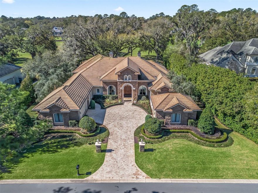 One-of-a-kind setting: gorgeous & renovated 4 bedroom & 4 1/2 bath plus office home on 1+ acres of land over-looking the exquisite Golden Ocala Golf & Equestrian Club golf course! The floor to ceiling windows offer picturesque views of the mature Oak trees & the 13th fairway showcasing a replica hole & wall from the famous St. Andrews golf course. Grand ceilings welcome you to the entry, formal living room w/ gas fireplace, formal dining area & wet bar. The gourmet kitchen has been recently modernized with new quartz counter tops, backsplash, new islands & newer high-end appliances including gas cook top, & boasts a large walk-in pantry. The living room is shaped by floor to ceiling glass retracting sliding doors that open seamlessly to the recently renovated generous patio & pool area. The primary suite is over-sized with gorgeous views, his & hers walk-in closets & stately 7- piece bathroom including his & hers toilet rooms. Many upgrades have been done inside the house including plantation shutters throughout, custom closet systems, updated light fixtures, newer high-end flooring, & custom floor to ceiling book shelf in office. The exquisite lanai area includes a recently refinished pool w/ waterfall, tanning ledge & spa, outdoor kitchen w/ grille, newer pool equipment, & the lanai cage/screen has been replaced. Additionally, the gutters have been upgraded to 6”, new landscaping package with lighting installed, & the front driveway pavers have been resealed. The Golden Ocala Golf & Equestrian Club is well located next door to the World Equestrian Center & boasts many on site amenities such as 27 holes of golf, 2 club houses, an equestrian center, fitness center, spa, resort-style pool, 3 restaurants, tennis club & more!