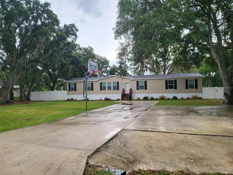 Photo of 8915 Hammock Loop, Polk City, Fl 33868 Loop, Polk City, FL 33868 (MLS # O6408977)