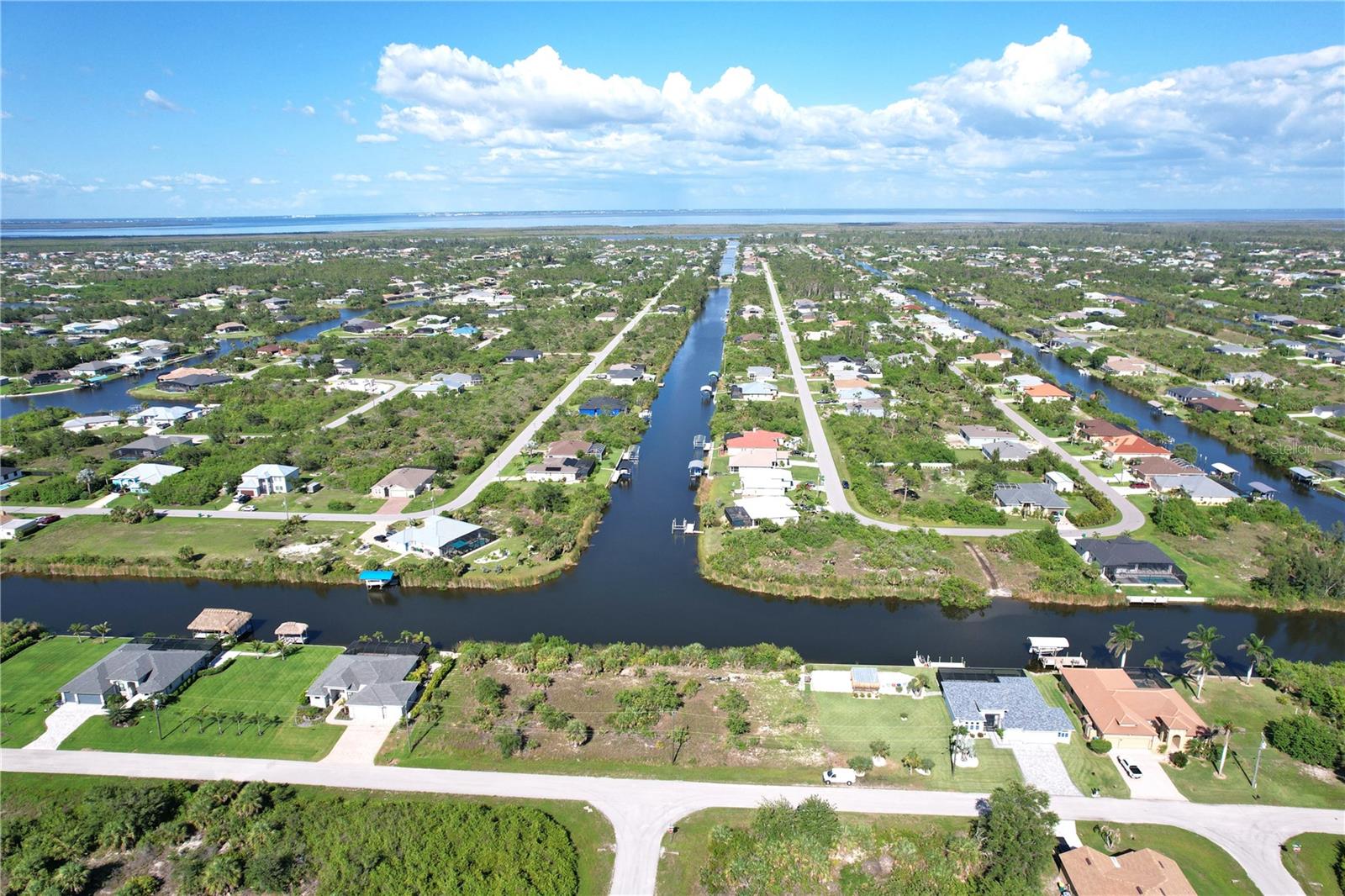 Salt Water front community (South Gulf Cove).
10,00 sq ft or 80 x 125 x 80 x 125 lot size.
Local amenities, beaches, and Tiki Bars and Live entertainment daily. The best Tarpon and red game fishing in the world with off speed boat racing to spring training baseball teams as The Atlanta Braves and Tampa Rays baseball teams. Just want to go to the local beaches (Port Charlotte, Boca Grande, Englewood and Sarasota beaches) or fishing for the day. Great to do it all with whatever you can dream or do as a hobby. Local International Airports: Fort Myers, Sarasota and local Punta Gorda with Allegiant airlines direct. Many outdoor concert venues weekly. Many local Tiki Clubs watch live entertainment to have a Sunset view. Local parks, state parks, tennis or pickleball, to amazing golf courses. You deserve to view this property and make it your home or investment. You even have room to add or build a new pool. Scrub jay free. No permit needed.