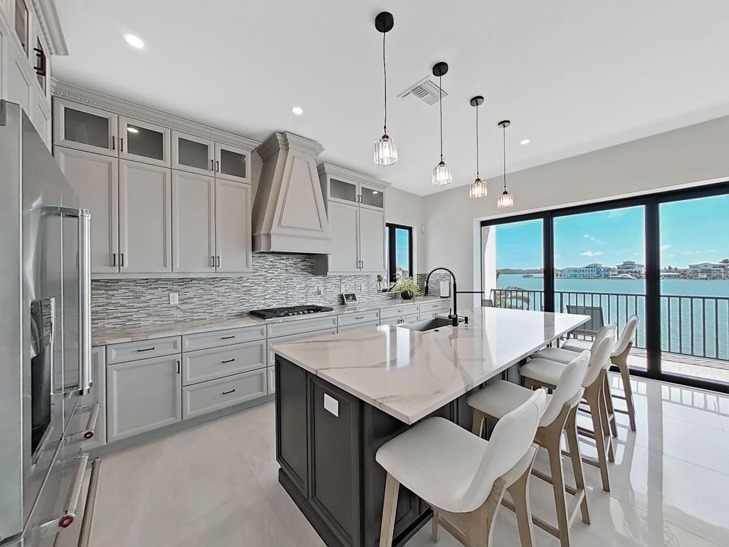 Photo of 882 Bay Point Drive, Madeira Beach, FL 33708 (MLS # TB8502609)