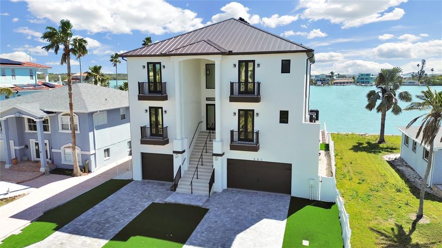 Luxury Coastal Retreat with Panoramic Intracoastal Views! Boasting breathtaking, wide-open views of the Intracoastal Waterway, this custom-built 5-bedroom, 5.5-bathroom estate offers an unparalleled blend of elegance and coastal charm. Wake up to endless sunrises in a home designed for both relaxation and entertaining. The gourmet kitchen features expansive counter space and abundant cabinetry, providing ample storage for all your culinary needs. The open-concept design seamlessly connects the kitchen, dining, and living areas, perfect for gatherings of any size. This exquisite retreat includes two primary suites, an elevator, Great Backyard ensuring effortless entertaining. Built with FEMA compliance, this home is as secure as it is stunning. Experience the pinnacle of luxury waterfront living—schedule your private tour today! **6 MONTH MINIMUM RENTAL** $150 admin fee due prior to move in.