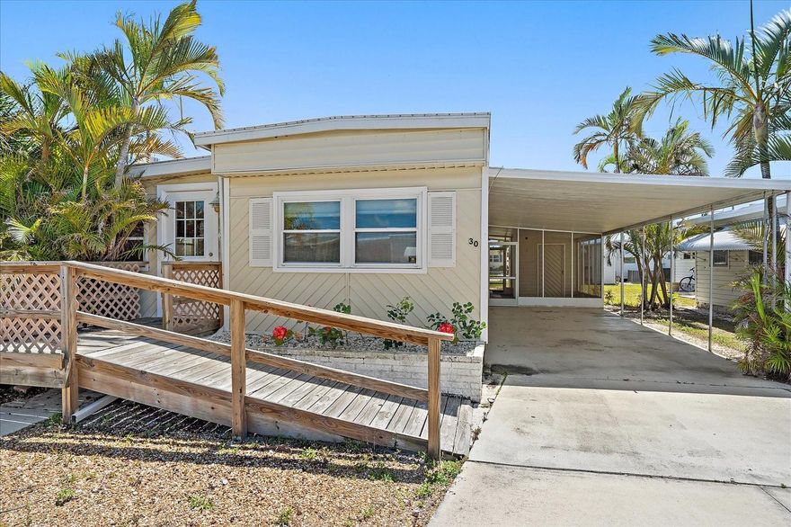 Paradise awaits in Tropic Isles on Terra Ceia Bay! This fully remodeled, move-in ready 2BR/2BA mobile home is tucked inside a highly sought-after waterfront boating community—offering the coastal lifestyle without the waterfront price tag.  Step inside and feel like it’s brand new with modern flooring, fresh paint, updated kitchen and baths featuring granite, newer appliances, and stylish finishes throughout.   Major upgrades include a roof-over (2016) and A/C (2017) for peace of mind.  Enjoy a bright, open layout perfect for full-time or seasonal living, plus effortless indoor-outdoor living with a screened lanai and oversized 24’ carport.   Located in Tropic Isles on beautiful Terra Ceia Bay, residents enjoy resort-style amenities including a marina, boat ramp, pool, spa, clubhouse, fitness center, bait shop, and shuffleboard.  Just minutes to Anna Maria Island beaches, Snead Island, dining, and easy access to St. Pete, Tampa, and Sarasota.   Exceptional value in a vibrant coastal community—homes like this don’t last.   Schedule your private showing today before it’s gone!