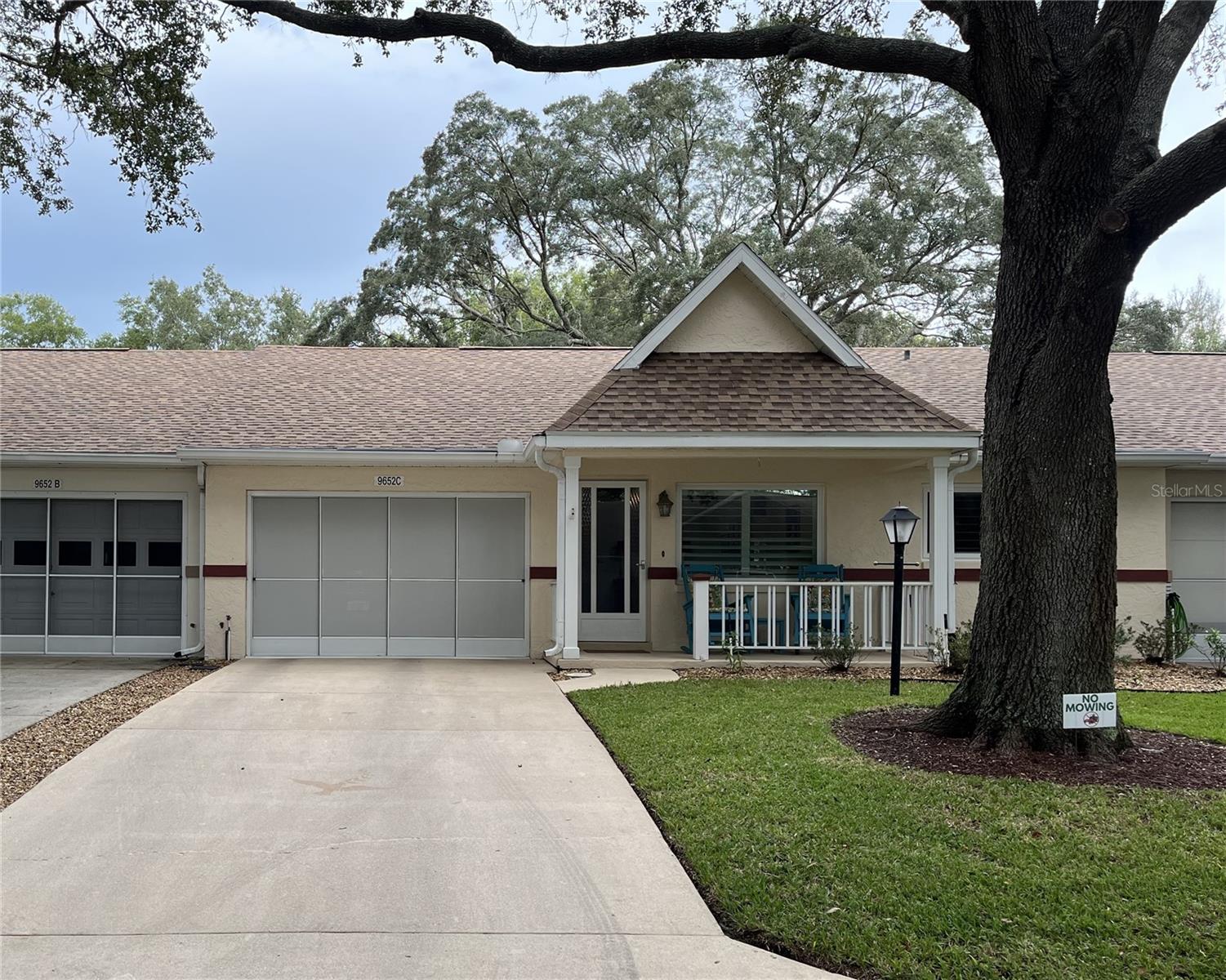This Lafayette model home is located in the much sought-after 55+ community of On Top of the World. The pretty villa has several upgrades throughout the home including *laminate flooring in the living areas *granite countertops in the kitchen *stainless steel appliances *pull outs in the pantry *newer carpet in the bedrooms *custom primary closet *newer vanities in the bathrooms with quartz countertops *epoxy garage floor *3 season Florida Room *Concrete pad for grilling AND a BRAND NEW ROOF! Call for your appointment to view today!