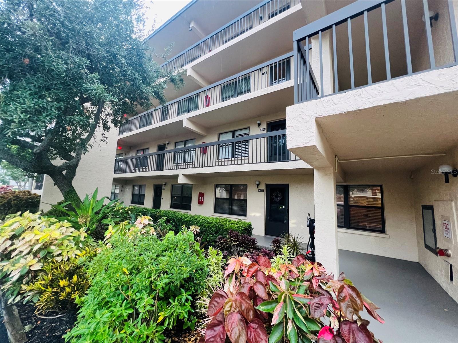 This lovely FIRST-FLOOR, 2-bedroom, 2-bathroom, condo is now available. Fantastic opportunity to own your home instead of renting! Located in Woodpark at DeSoto Square, a GATED, PET-FRIENDLY, 55+ community that offers a wonderful lifestyle. Residents can enjoy fantastic amenities including a HEATED POOL, clubhouse, fitness center, and the convenience of an on-site manager. The community is beautifully maintained, surrounded by lush tropical foliage and featuring a serene pond with a fountain. This unit features the DRIFTWOOD FLOOR PLAN, which is the LARGEST FLOOR PLAN available in Woodpark. It includes an ENCLOSED, AIR-CONDITIONED LANAI, providing wonderful added living space that would be perfect for a home office or a versatile flex room. The condo is truly move-in ready with RECENT UPDATES, including a dishwasher that is only two years old, as well as newer ceiling fans, and lighting fixtures. The kitchen is also well-appointed with a convenient center island. You'll also appreciate that the AC is just ONE YEAR OLD and comes with a 9-year warranty, offering peace of mind. The unit comes with a convenient carport with additional storage. Located in the heart of Bradenton, close to Anna Maria Island, shopping, excellent restaurants, and the airport. There are NO current special assessments, and the condo fee includes basic cable. Woodpark has a strict rental policy, with only 20% of units permitted for lease and a three-year ownership requirement. Ensuring a strong sense of residential ownership within the community. Furnishings are negotiable.