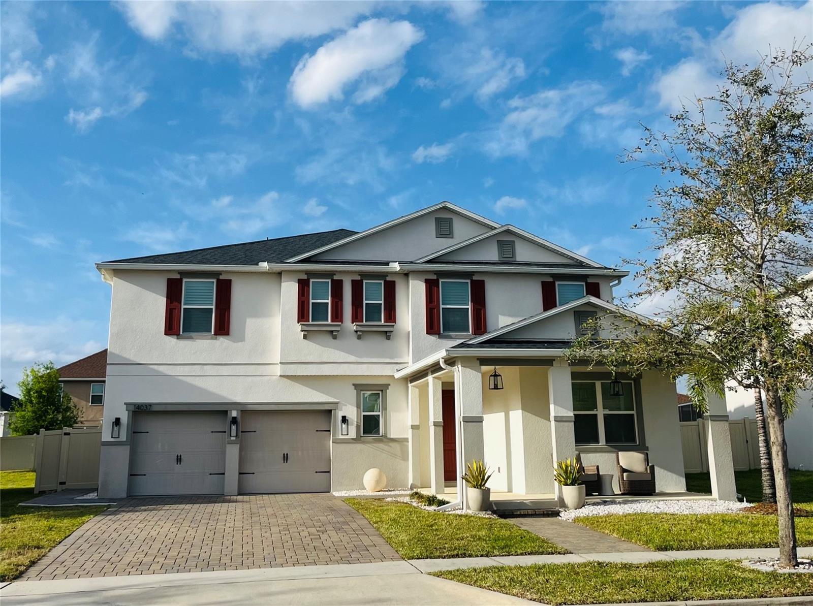 This beautiful 3,793 sq. ft. home in Orchard Park offers 5 bedrooms and 4.5 bathrooms, including a guest bedroom with an en-suite bath downstairs. The home features plantation shutters throughout, luxury vinyl flooring, new appliances, and freshly painted interiors. The open kitchen, with granite countertops, oversized island, and walk-in pantry, is perfect for preparing meals and gathering with loved ones.
Upstairs, the owner’s suite offers a huge walk-in closet and a luxurious bath. Two generously sized bedrooms with walk-in closets share a bathroom with double sinks, while another bedroom with an en-suite bath was added with a permit. A spacious second-floor loft and laundry room complete the upper level, offering plenty of room for all of your needs.
The outdoor space is just as inviting, with a completely fenced-in backyard, covered porch, and rear patio—ideal for enjoying the Florida sunshine and relaxing in privacy. HOA fees cover landscaping, taking the hassle out of yard maintenance. Located near Winter Garden Village and zoned for Keenes Pointe Elementary, Bridgewater Middle, and Windermere High School, this home seamlessly combines luxury, style, and an unbeatable location. Don’t let this one pass you by!