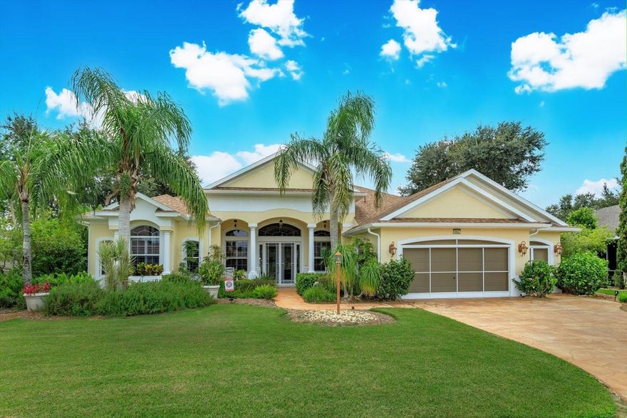 Gorgeous home is situated on a conservation lot with panoramic views of fields, trees and nature.  The Palatlakaha River borders the common land, behind the property,  The house is the sterling model with 3034 sq. ft of living space and a grand total of 4,490 sq ft. Greek columns, 2 bedrooms, 2 baths plus a huge den/family room, and floor to ceiling sliding doors covering the entire back of the house.  go through the double glass doors to enter the home to go into the high indented ceiling which has hidden lighting, in-ceiling multi speaker/multi room surround sound and crown molding.  Over the gas fireplace with room to mount any flush mount TV.  a formal dining area and a spacious open eat-in kitchen with a large seat bar.  it has 42" cabinets, pull out drawers, Corian countertop, large walk in pantry, built in wine rack, water filter, trash compactor and a ledge for display items lit by subtle lighting.  The split bedroom design includes a luxurious master suite with cathedral coffered ceiling, subtle lighting, a huge walk-in his and hers closet, instant hot water and a shower with dual shower heads.  Home is wire for home theater & surround sound.  Full house generator in 2022, new roof 2021, new A/C 2024.