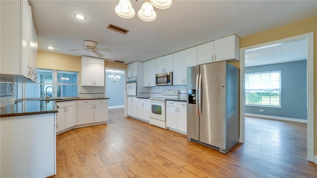 Photo of 909 SE 27th Street, Cape Coral, FL 33904 (MLS # C7531863)