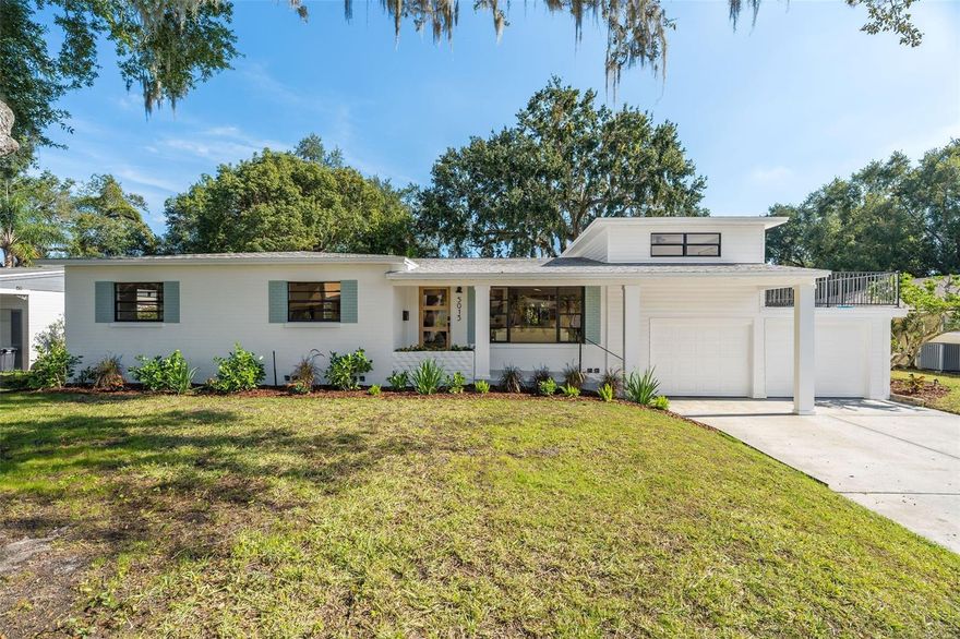 Life’s too short to live in a boring tract home! Welcome home to 5013 Monet Avenue, a RARE Belle Isle designer residence framed by heritage oaks and magazine-worthy curb appeal. This professionally interior-designed FULLY RENOVATED 4-bedroom, 3-bath, two-story POOL HOME blends timeless mid-century character with intentional modern design. Dual primary suites, open-concept living, and refined finishes create a home that feels elevated, flexible, and effortlessly livable.
• Defined by a striking front facade and thoughtfully curated landscaping, the home makes a strong first impression by day and comes alive at night with warm exterior accent lighting. A modern solid wood front door sets the tone as you step inside to a bright, open living space filled with natural light from expansive windows.
• The living room flows seamlessly into the kitchen, creating an inviting layout ideal for both everyday living and entertaining. The kitchen features 42-inch solid oak cabinetry, a thoughtfully scaled centerpiece island, Calacatta quartz countertops, champagne bronze fixtures, and a well-appointed stainless steel appliance package—equal parts functional and design-forward.
• The main-level primary suite offers serene pool views, a walk-in closet, and a spa-inspired ensuite bath with a curbless shower, bespoke tilework, and a sleek frameless glass enclosure. Upstairs, a rare private suite with its own terrace provides exceptional flexibility—perfect as a guest retreat, home office, or creative studio. Two additional bedrooms with ample storage, fresh finishes and a re-imagined guest bath complete the interior.
• French doors lead to a formal dining room that transitions into an expansive family room with panoramic backyard views and a charming fireplace—an ideal setting for gatherings, holidays, or relaxed evenings at home.
• Outdoors, enjoy a private backyard oasis featuring a newly resurfaced swimming pool, covered lanai, and a fenced yard surrounded by mature oaks and lush landscaping. A 2-car garage and additional storage shed add everyday practicality.
• Located in the golf cart–friendly Belle Isle community, residents can enjoy access to tennis courts, a boat launch, and a picturesque waterfront gathering area with a modest annual fee. Conveniently close to Orlando International Airport, downtown Orlando, and premier shopping and dining.
• 2026 is your year to purchase your dream home! With full updates throughout: Roofs (2018/2025), Electrical (2025), Pool (2025), ACs (2020/2025) WH (2025), this is a truly move-in-ready, one of a kind home—rare, refined, and unforgettable from the very first moment. Schedule your private showing today!