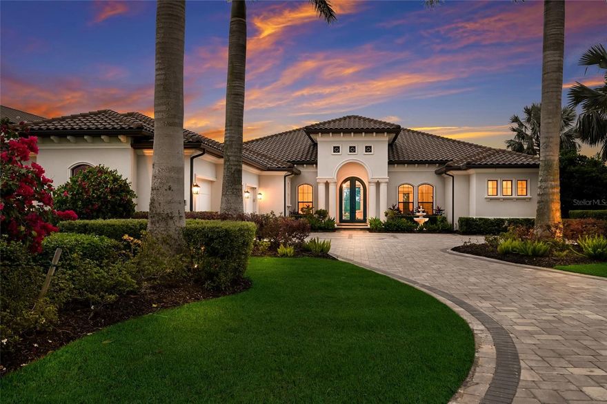 Set on over one acre with serene water and preserve views, this custom Lee Wetherington residence offers a refined balance of thoughtful design, privacy, and relaxed luxury living. Positioned to capture the natural beauty of its surroundings, the homesite provides a sense of quiet seclusion while remaining moments from Lakewood Ranch’s most desirable destinations. The well-designed floor plan offers both comfort and versatility, featuring three bedrooms, four bathrooms, two private offices, and a spacious bonus room, ideal for work, relaxation, or hosting guests. The primary suite serves as a true retreat, where double doors open directly to the lanai, inviting in soft natural light and tranquil views. The spa like bath features a large walk-in shower, soaking tub, dual sink vanity with custom cabinetry, and generous custom walk-in closets. Privately positioned within the split floor plan, the two guest suites offer exceptional comfort and privacy for visitors. Each suite includes a walk-in closet and an ensuite bath with oversized custom tiled showers, creating a welcoming and well-appointed space for family and guests alike. At the heart of the home, the chef’s kitchen blends beauty and functionality, appointed with a Miele induction cooktop and hood, Miele dishwasher, Sub Zero refrigerator, and Wolf microwave and oven. A large walk-in pantry provides additional storage and convenience, while the open design allows the kitchen to flow effortlessly into the surrounding living spaces, making it equally suited for everyday living and entertaining. Designed to embrace Florida’s indoor-outdoor lifestyle, expansive sliders from the great room open to an oversized lanai overlooking peaceful water and preserve views. The outdoor living space offers a pool and spa, outdoor kitchen, and generous areas for both dining and lounging, creating an inviting setting for relaxed afternoons or elegant evening gatherings. A perfect blend of functionality and privacy, the setting invites beautiful sunrises, sunny afternoons by the pool, and peaceful evenings enjoying the tranquil natural surroundings. The pool was refreshed with new PebbleTec in 2025, while the ClearView screen enclosure allows the surrounding landscape to remain the focal point. Additional features further enhance the home’s comfort and functionality, including a whole house generator, two tankless hot water heaters, and two air conditioning systems. An extended three car garage offers generous space for vehicles, storage, or recreational equipment. Located within the gates of The Concession and just minutes from UTC, Waterside dining and shopping, and the Gulf Coast’s renowned beaches, the home offers convenient access to Sarasota’s vibrant lifestyle while maintaining the privacy and exclusivity that define the community. Opportunities to enjoy this level of privacy, thoughtful design, and expansive outdoor living are truly rare.