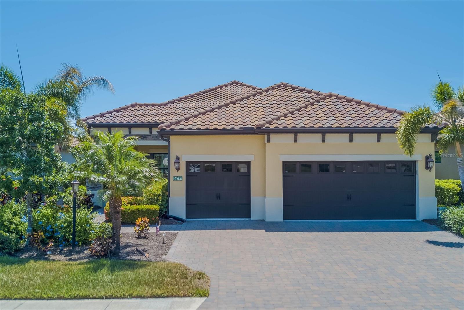 Your Dream Home Awaits! Located in the highly sought-after gated, golf community of Boca Royale, this beautifully designed Sea Mist floor plan combines comfort, style, and a true Florida lifestyle. From the moment you arrive, the brick-paver driveway, manicured tropical landscaping, and stacked-stone details create an inviting first impression. Inside, you’ll find a bright, open layout filled with upgrades and thoughtful touches. The gourmet kitchen is a showpiece, featuring quartz countertops, dovetailed soft-close cabinetry, stainless steel wall oven with microwave, a gas cooktop with vented hood, under-cabinet lighting, and a deluxe refrigerator. The dining space, accented with plantation shutters and shiplap details, overlooks the lanai through triple sliding glass doors, offering seamless indoor-outdoor living. Step outside to your private retreat with a heated saltwater pool, soothing waterfall feature, and tranquil water views—the perfect backdrop for relaxing evenings or entertaining guests. The lanai is already plumbed and wired, ready for your dream outdoor kitchen. The expansive master suite offers a peaceful escape, complete with a coffered ceiling, plantation shutters, dual walk-in closets, and a spa-inspired bath with quartz counters, dual sinks, a large glass-enclosed shower, and private water closet. Two additional bedrooms share a well-appointed bath with glass-enclosed tiled shower, while the den with French doors provides the perfect space for a home office, hobby room, or quiet getaway. Additional features include: Custom impact-glass front door ,Storm Smart electric roll-down hurricane shutters for the lanai ,oversized 31x21 three-car garage, wood-look tile flooring in main living areas, upgraded lighting, ceiling fans, crown molding, and detailed trim work throughout and oversized laundry room. Living in Boca Royale means more than just a home—it’s a lifestyle. Residents enjoy a newly renovated clubhouse with a restaurant and bar, an 18-hole golf course, fitness center, tennis and pickleball courts, and a resort-style pool. All this, plus you’re just minutes from Gulf beaches, local shops plenty of dining options. This move-in ready home is the perfect blend of elegance and coastal charm. Don’t miss the opportunity to make it yours!