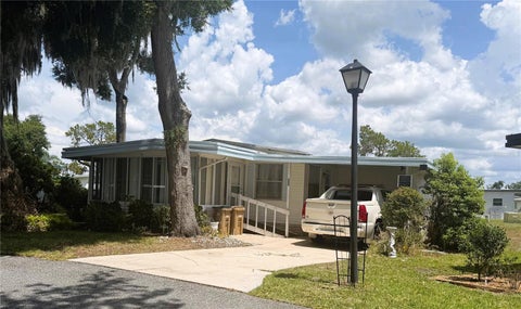 Tiny photo for 209 Jacaranda Drive, Leesburg, FL 34748 (MLS # R4911523)
