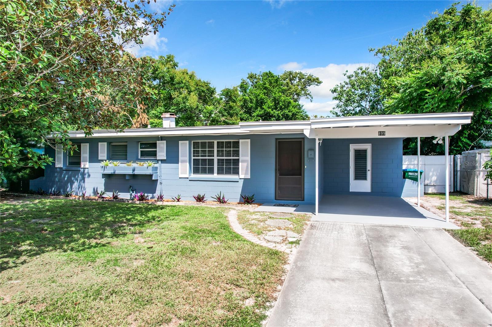 MOVE IN READY 3 BEDROOM 1 1/2 BATH HOME WITH A 1 CAR CARPORT, FRESH INTERIOR AND EXTERIOR PAINT, NEW CARPET IN BEDROOMS 8/2024, TILE THOUGHOUT OTHER ROOMS, CROWN MOLDING, INSIDE LAUNDRY ROOM WITH A WASHER & DRYER, 15 x 11 SCREENED LANAI OVERLOOKING LARGE BACKYARD, CONCRETE SLAB IS READY FOR A NEW SHED.