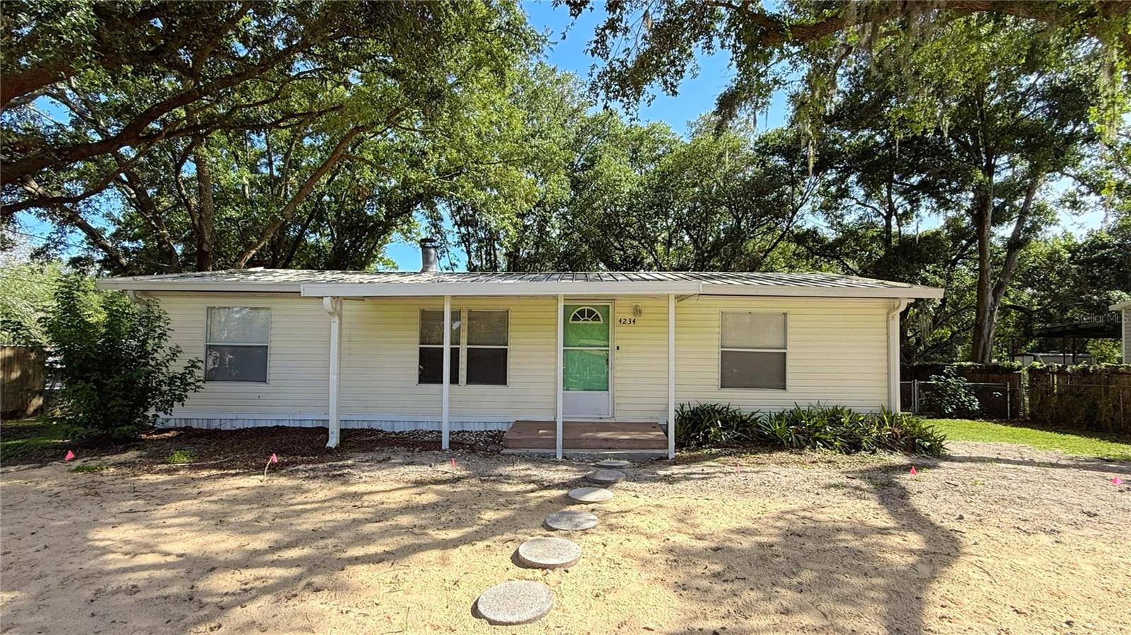 Move-in ready 3 bedroom, 2 bath home with shaded 1/2 acre lot is waiting for a new owner. The kitchens and baths have NEW hard surface counters, cabinets, fixtures and newer appliances. Easy care Luxury Vinyl Plank flooring throughout and ceiling fans in most rooms. Enjoy the screened porch and privacy of a fenced backyard. Home is located between Lakeland and Winter Haven, in Auburndale, a quiet Florida town.