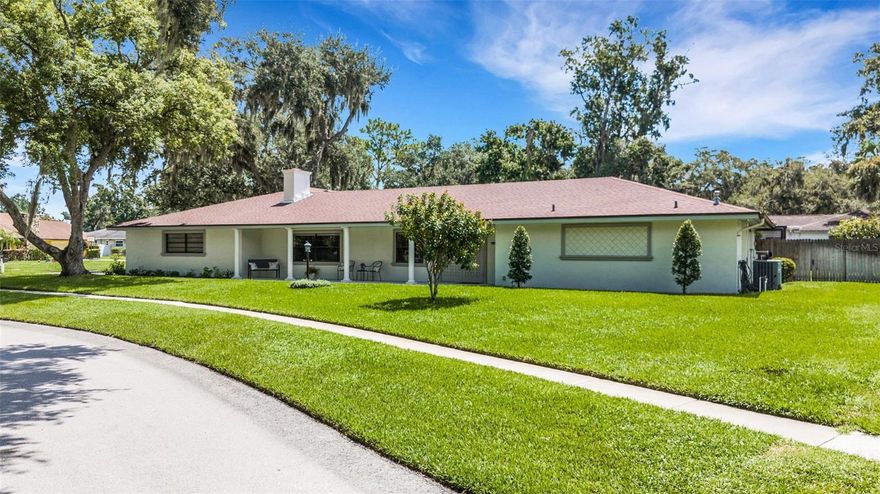 Welcome to Christina Woods, one of South Lakeland’s most sought-after neighborhoods, where shady trees, lush landscaping, and an oversized
corner lot set the stage for this beautifully updated 4-bedroom, 3-bath pool home. From the moment you step inside, you’ll notice the charm and
thoughtful updates throughout, including wood-look ceramic tile in the main living areas and brand-new carpet in the primary suite. The gourmet
kitchen is a showstopper with raised-panel wood cabinetry, soft-close features, granite countertops, stainless steel appliances, a gas cooktop with
decorative exhaust hood, built-in oven and convection oven, plus a spacious island with seating, extra storage, and a convenient pass-through
window to the pool area. Formal living and dining rooms offer traditional appeal, while the gorgeous family room steals the spotlight with its
wood-burning fireplace, custom bookcase, and built-in desk—perfect for work or hobbies. The split-bedroom layout provides privacy for everyone.
The glamour primary suite is your private retreat with sliding doors to the pool area, a huge walk-in shower, dual vanities with granite counters,
and a separate bath area. Three additional bedrooms are generously sized—one with its own ensuite bath, another with direct porch access, and
a shared pool bath with double sinks and granite counters. Sliding doors from the kitchen, living room, and primary suite lead to the
entertainment-sized screened porch with a custom tile floor and sparkling pool surrounded by a paver deck. Additional features include a 2-car
side-entry garage, inside laundry with storage and mop sink, 2 hot water heaters, and a wood privacy fence. All of this in a fantastic location
close to schools, parks, shopping, dining, and all that Lakeland has to offer. Call today for your private showing!