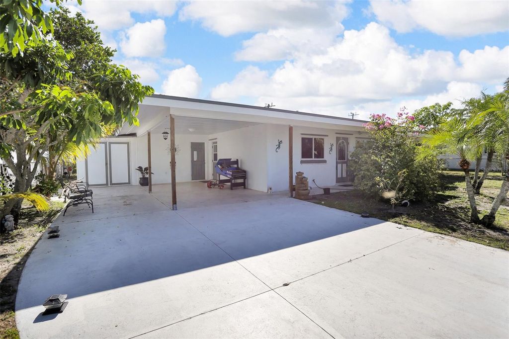 Photo of 525 Skylark Lane NW, Port Charlotte, FL 33952 (MLS # TB8487093)