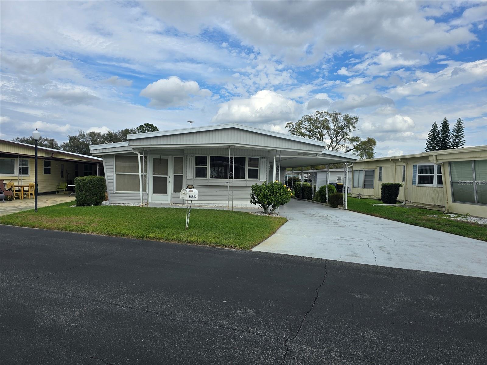Don’t miss this incredible opportunity to own a charming, well-maintained home in the desirable Ariana Shores, a 55+ community! This cozy residence is ready for your personal touch, offering the perfect blend of comfort and potential.
Quaint living room is an ideal spot to relax, while the Florida room provides additional space for entertaining or simply soaking up the Florida sunshine. The eat-in kitchen has plenty of cabinets to store all of your kitchen goods. The attached garage/shed is perfect spot to add washer and dryer hookups. Fully furnished home, just bring your clothes and tooth brush.
This property is part of a co-op, with each share valued at $30K, which is conveniently included in the sale price. Co-op living means you’re part of a close-knit, engaged community where residents have a voice in how the neighborhood is run. The community offers fantastic amenities such as a heated pool, shuffleboard courts, a fishing pier, and a boat ramp leading to the scenic Lake Arietta. Make this move-in-ready gem your next home—schedule a showing today and seize this amazing opportunity!